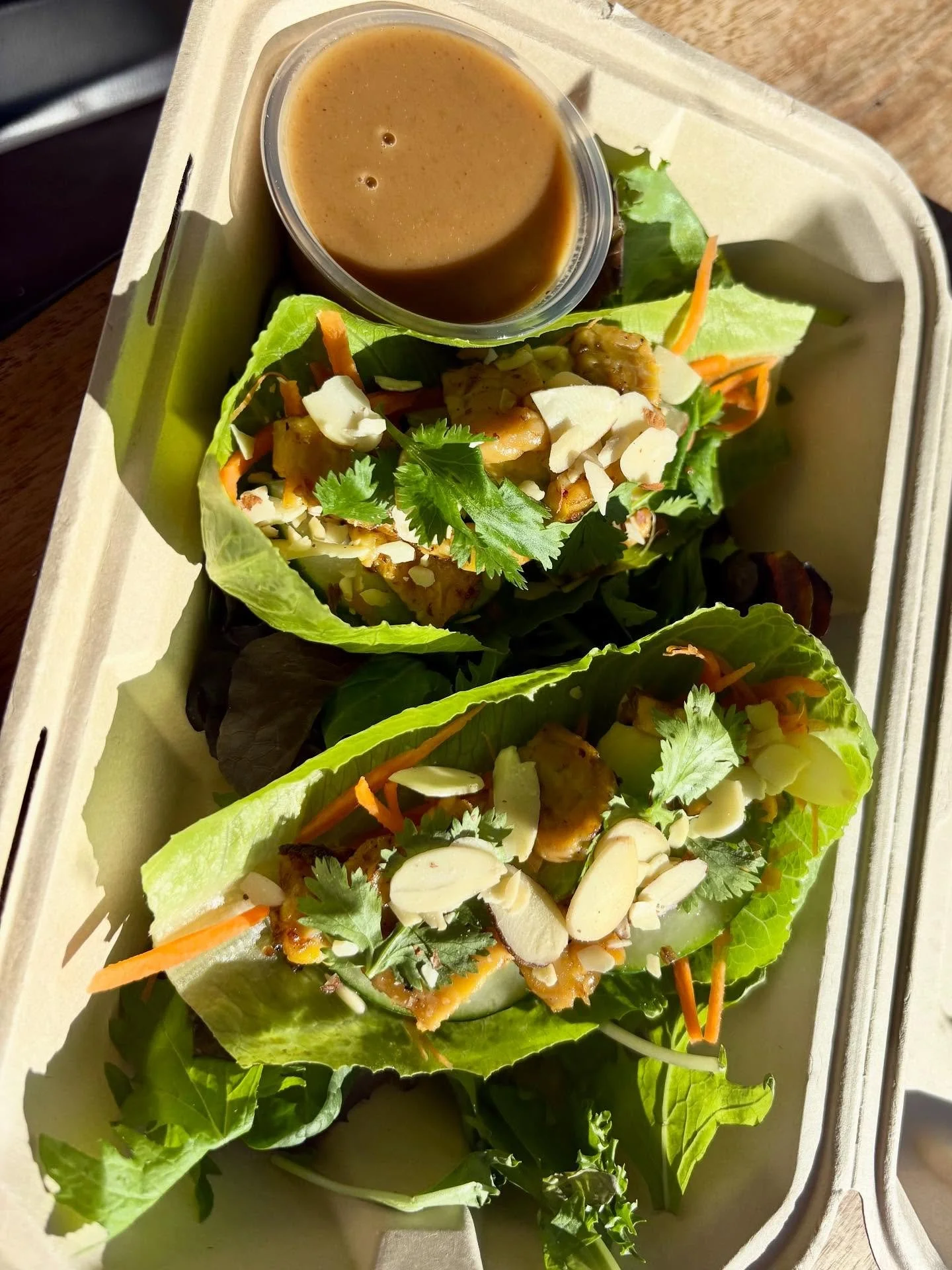 🌯 Tempting Tempeh Wraps are HERE! 🌱
Get ready to fall in love with 4 crave-worthy wraps served over a bed of fresh spring mix.

Stuffed with:
🥕 Carrot
🥒 Cucumber
🥑 Avocado
🌿 Cilantro
🌰 Sliced almonds
🔥 Marinated tempeh

Served with our addict