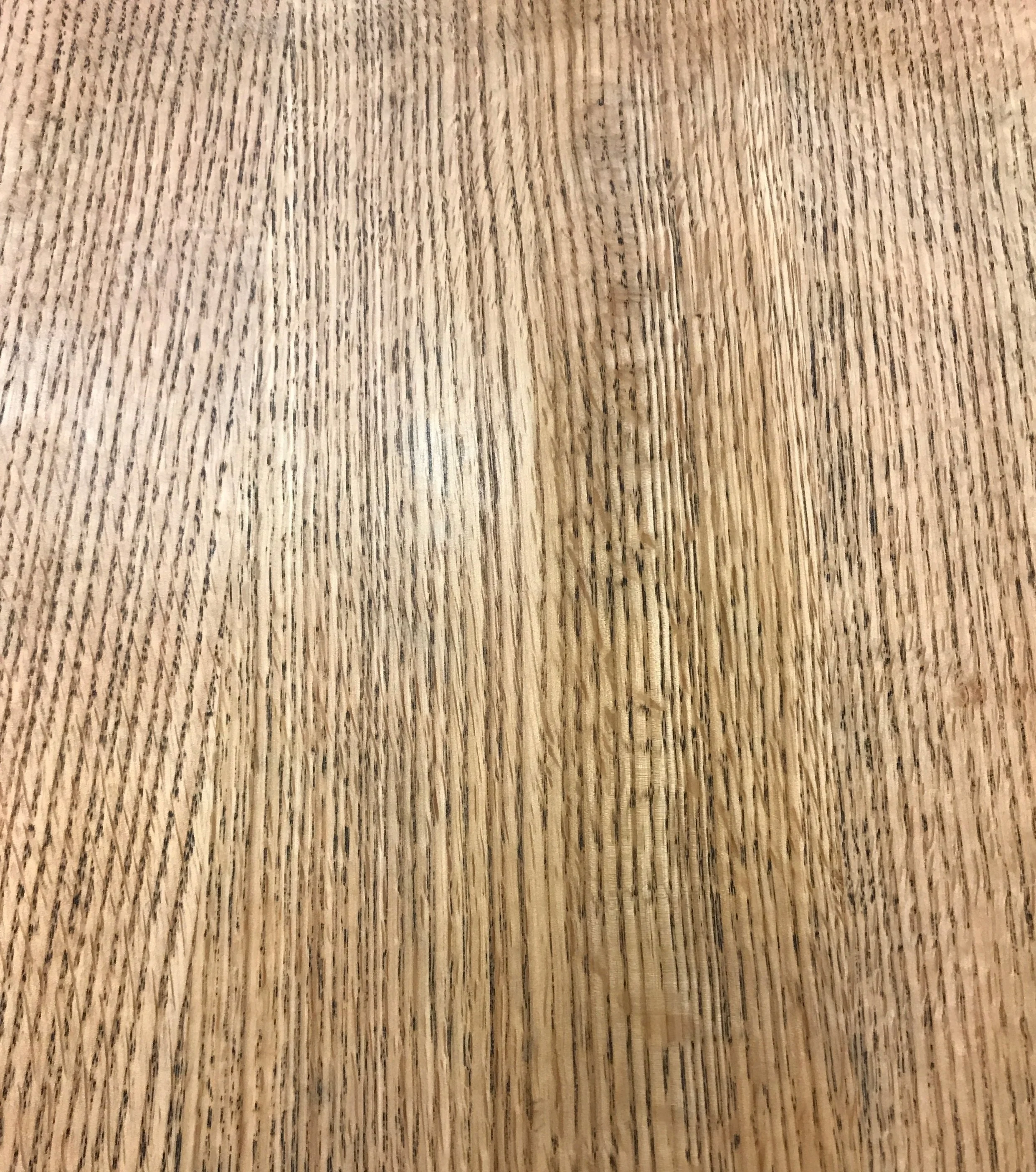 red oak with black grain filler to accent the wood's natural pores