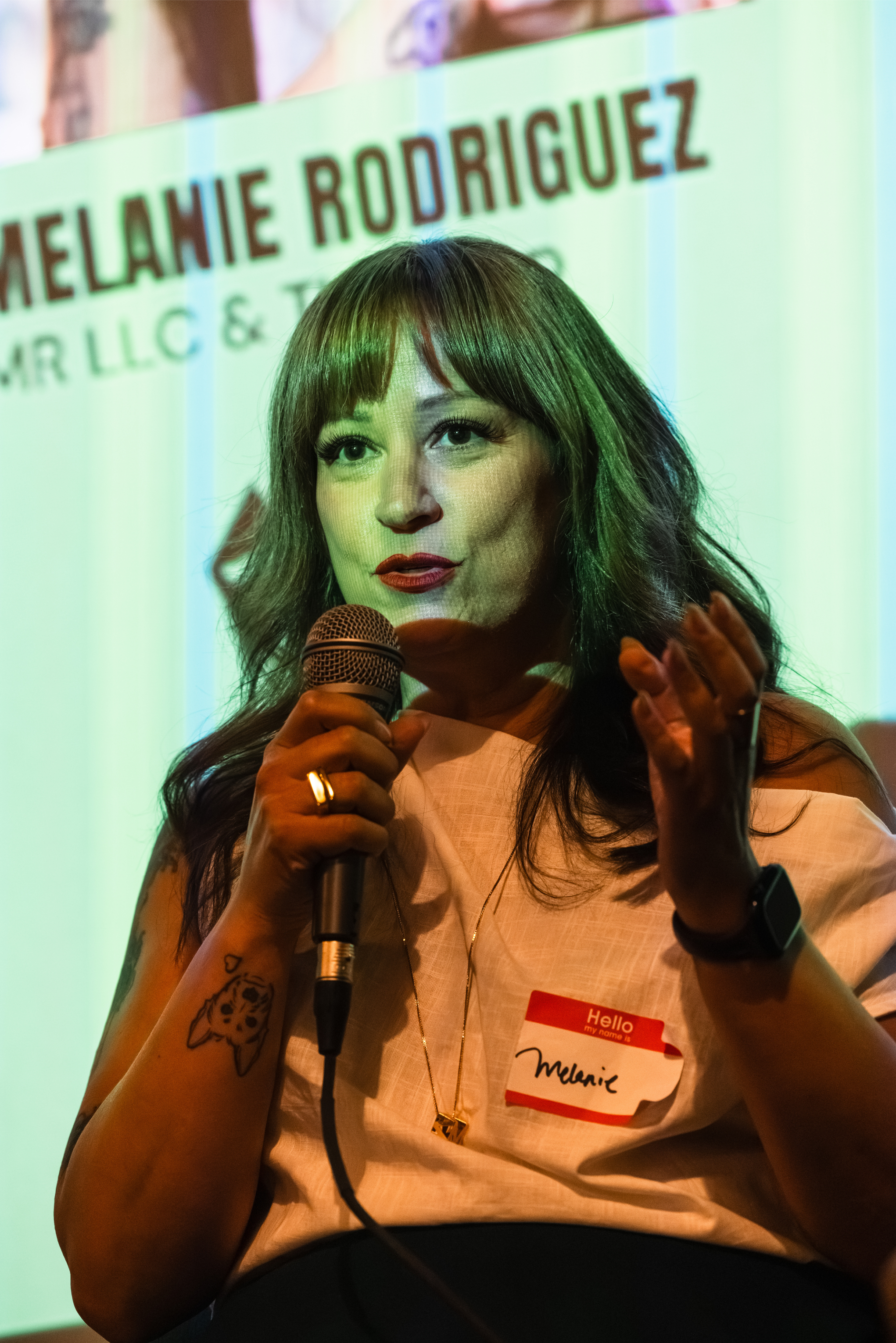 Photo of Melanie, speaking at NYMM. Taken by Jason Bailey.