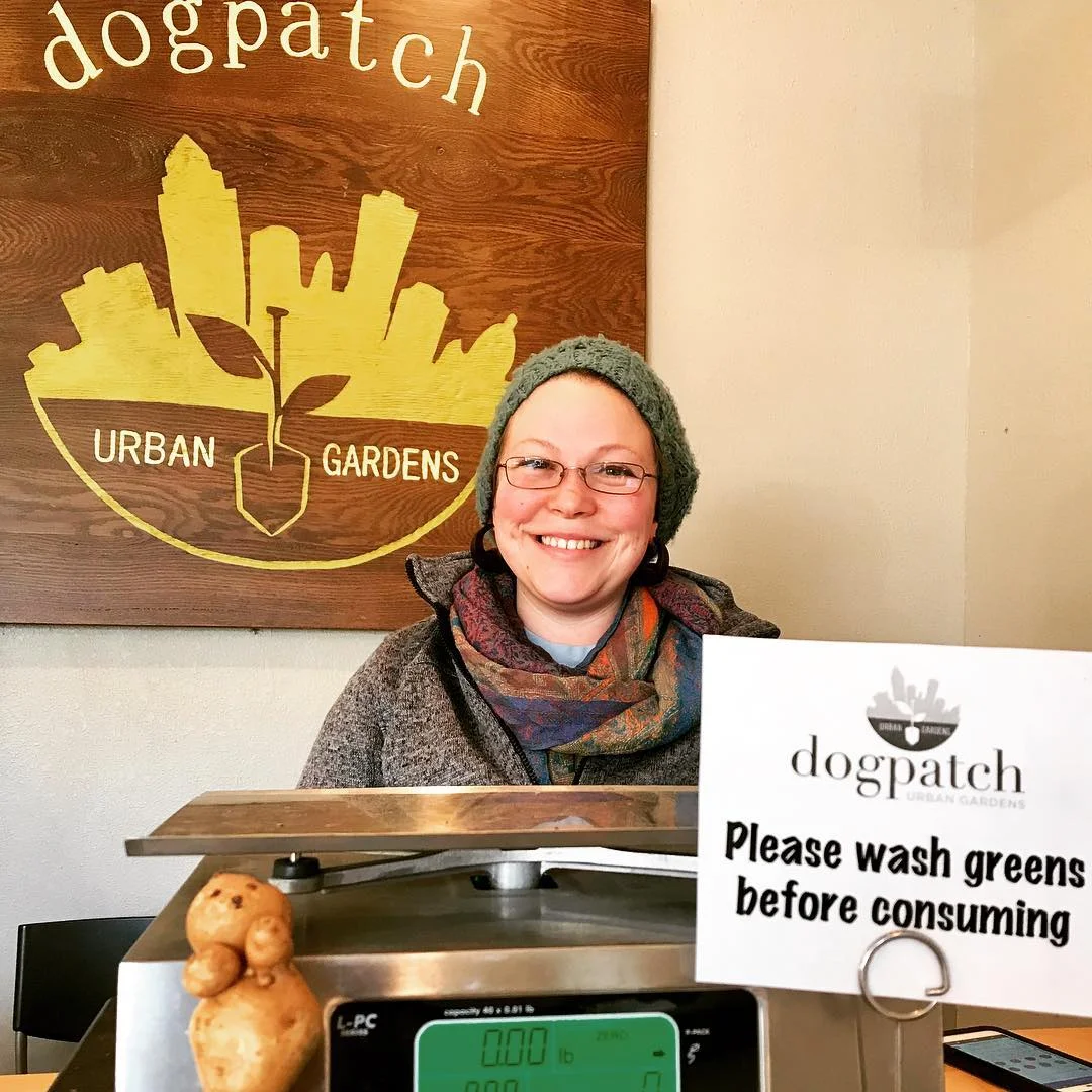 Katy Jo's smiling face behind the counter