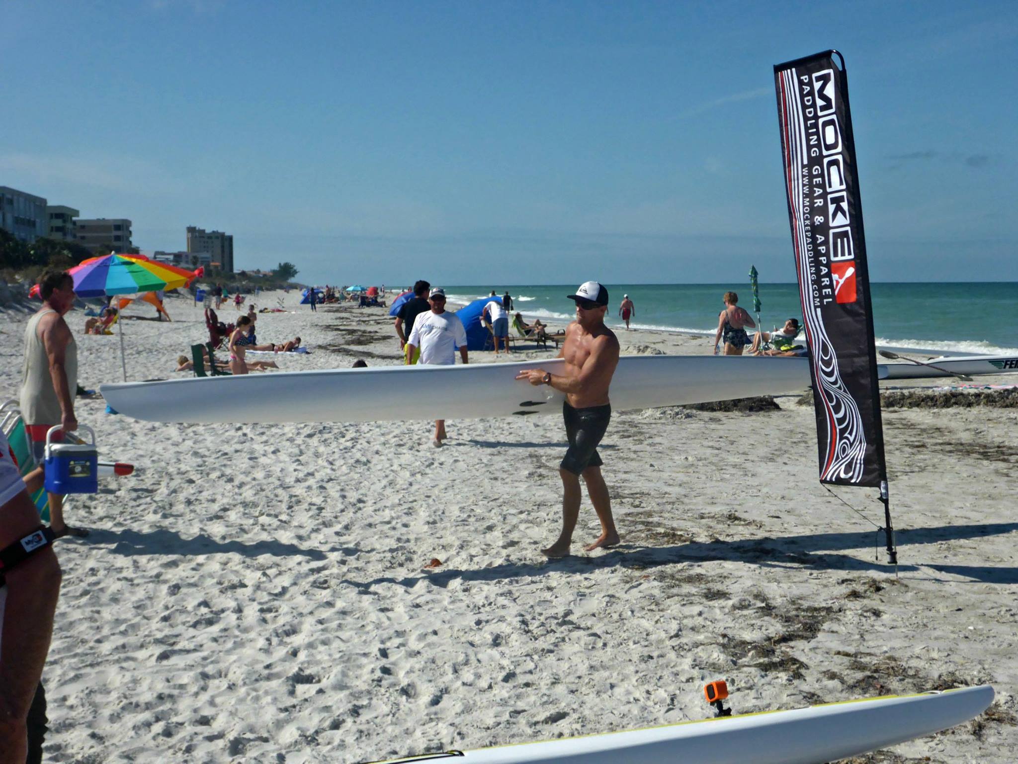 JP Atherholt helping carry another paddler's boat -- exemplifying sportsmanship worthy of the David Bell Trophy