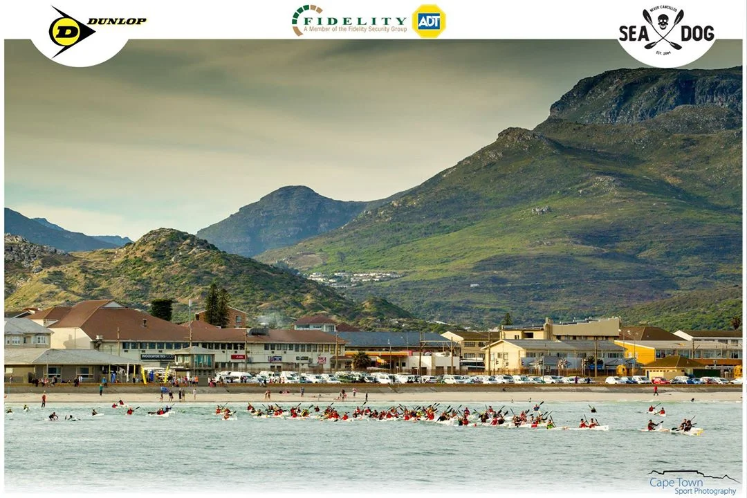 Paddlers make their way out of the beautiful Fish Hoek bay for the Dunlop Race 7. (Photo: Cape Town Sport Photography)