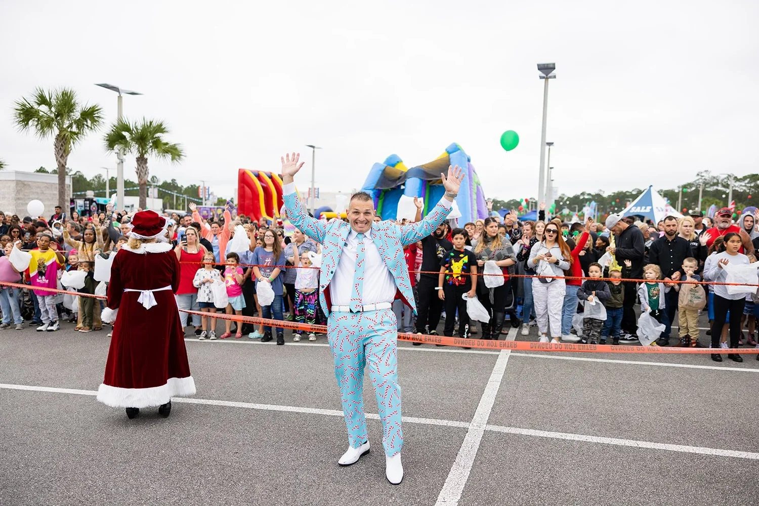 Large community event with guests gathered for a holiday celebration photographed by Dreamscape Photography + Video in Central Florida.