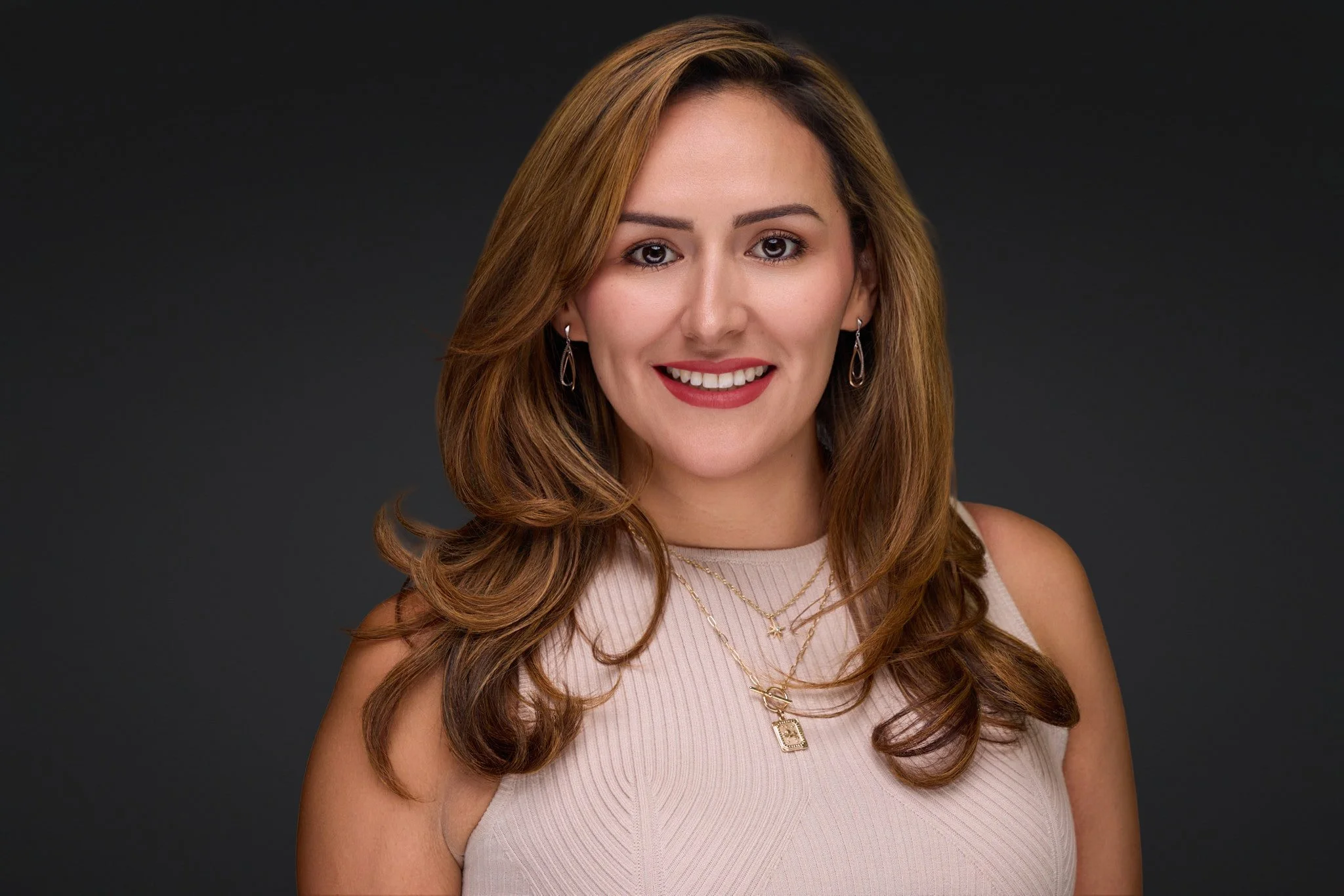 Professional studio headshot on a dark gray backdrop by Dreamscape Photography in DeLand, Florida.