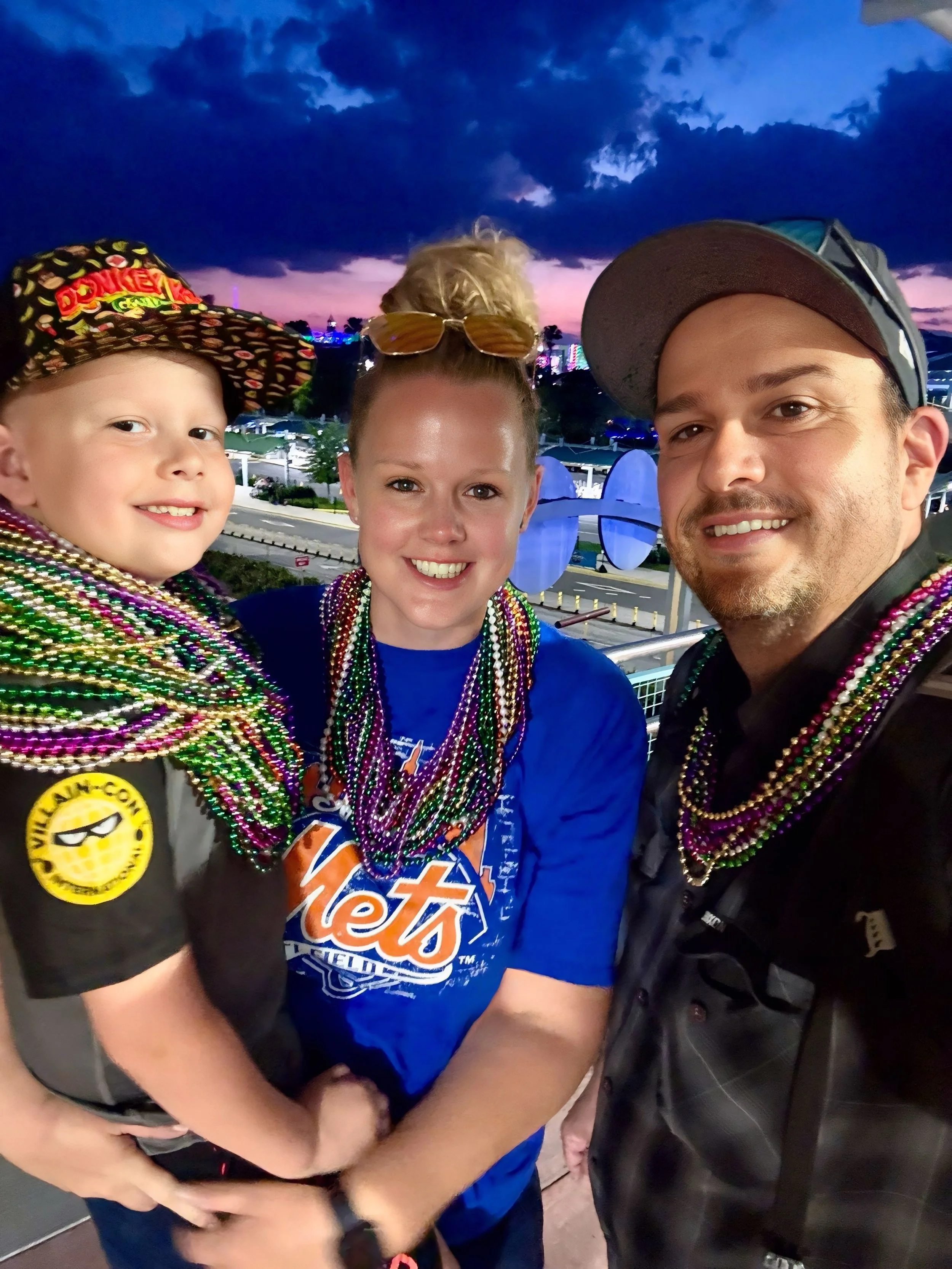 Family enjoying a colorful evening adventure together in Central Florida.
