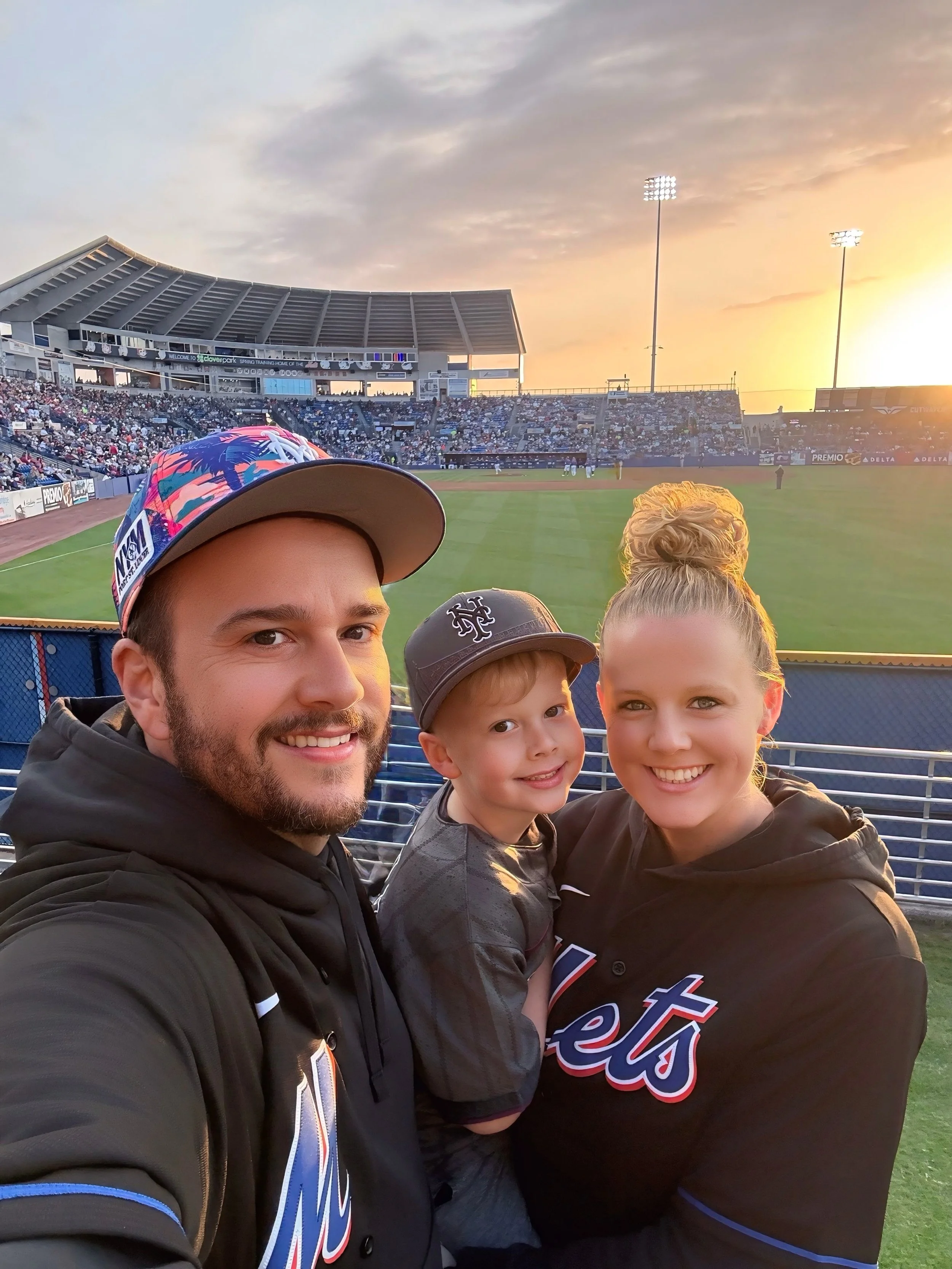 The family behind Dreamscape Photography enjoying a baseball game together.