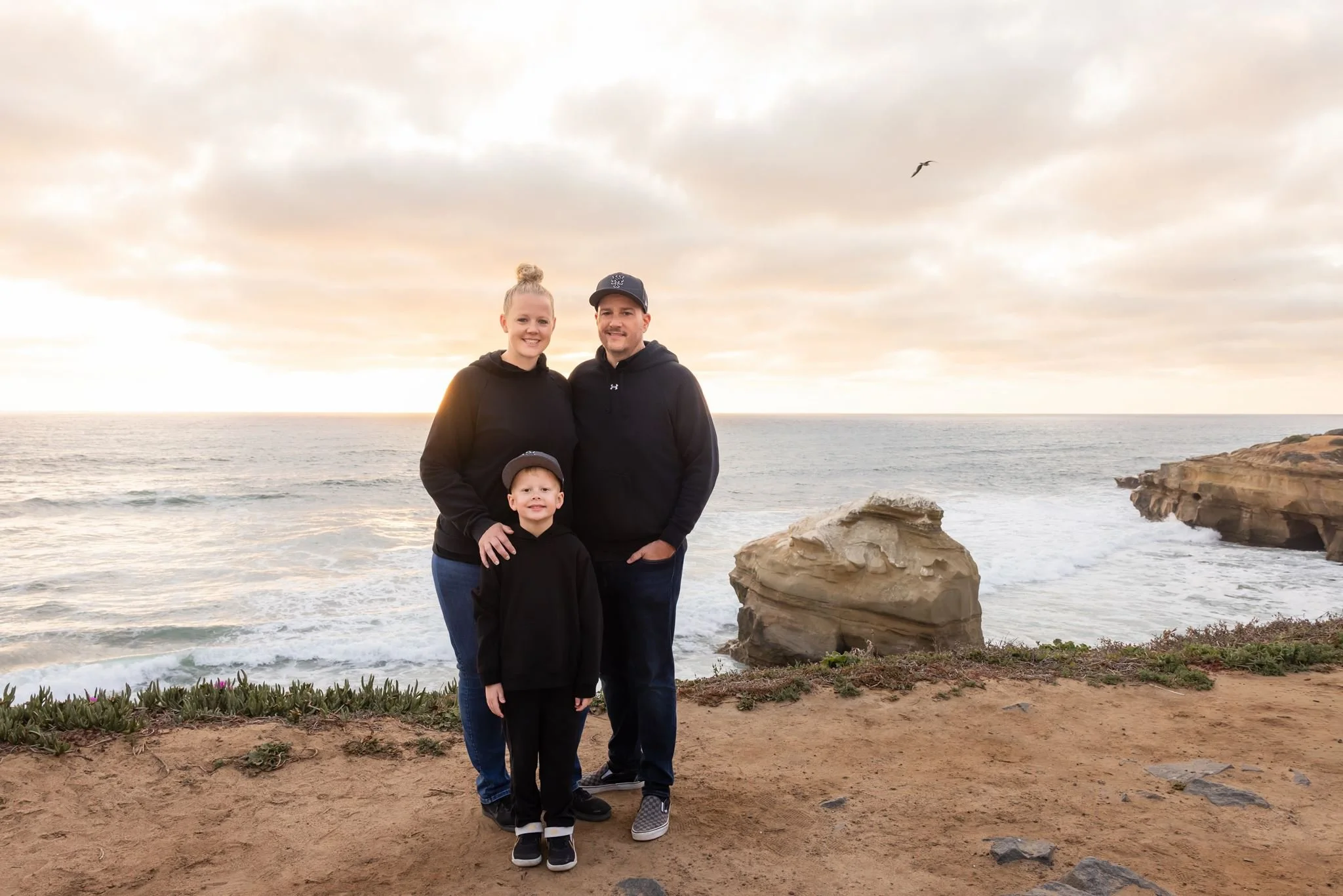 Michael, Nicole, and Colin together along the California coast during a family trip.
