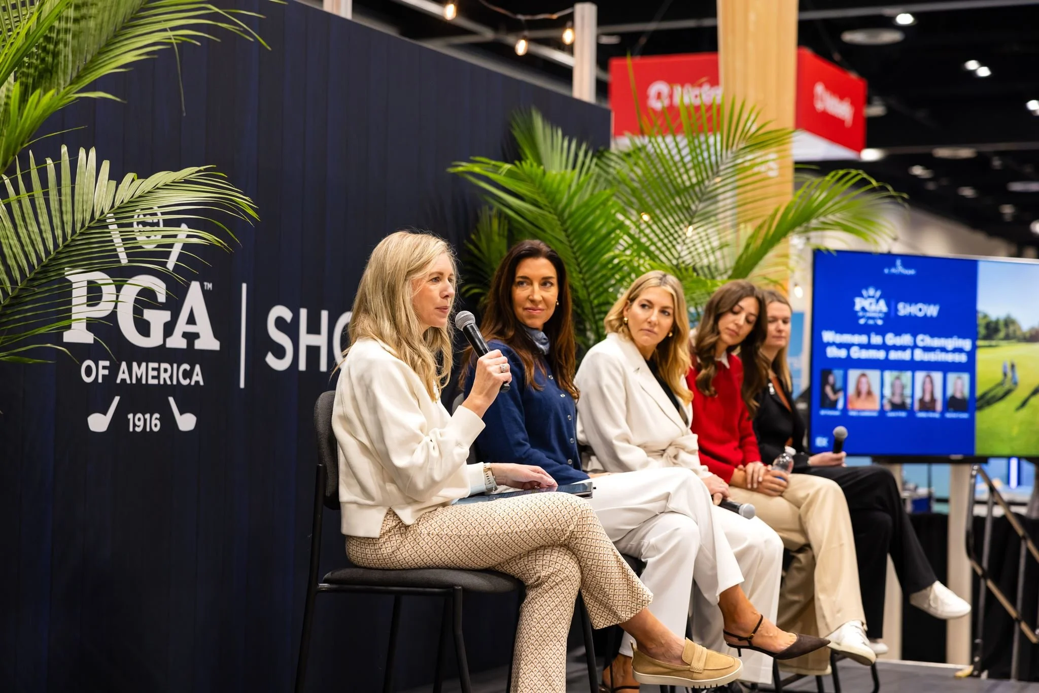 Panel speakers at a professional trade show event photographed by Dreamscape Photography + Video in Orlando, Florida.
