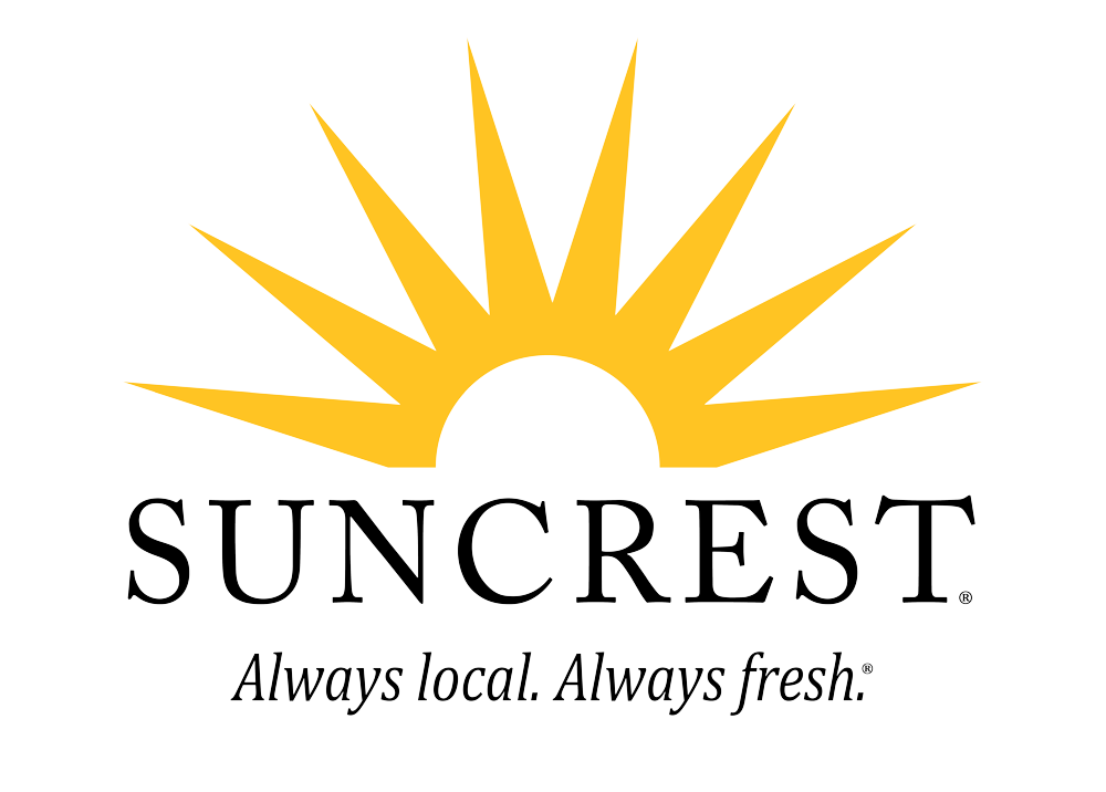 The mark shows off a rising sunburst from behind a tunnel-style greenhouse. The upward feeling is bright, light, fresh and in-synch with the Suncrest name.