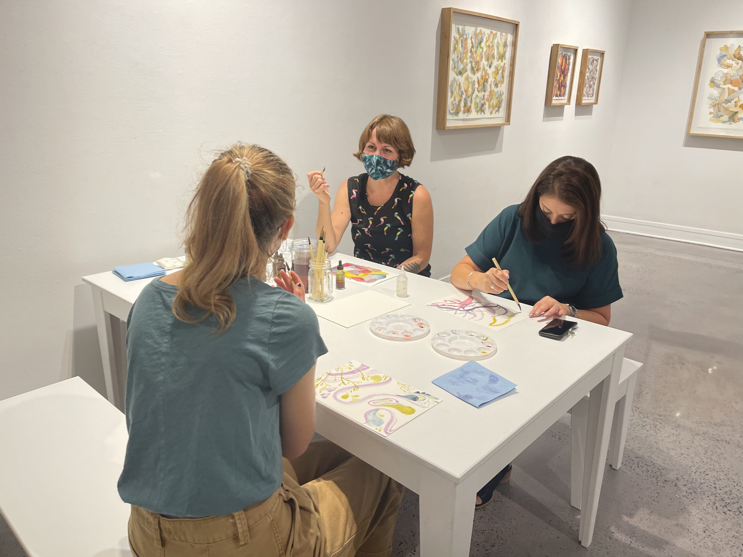 Participants painting with bio inks in the Huumannatuure Lab at Davidson College, 2021.