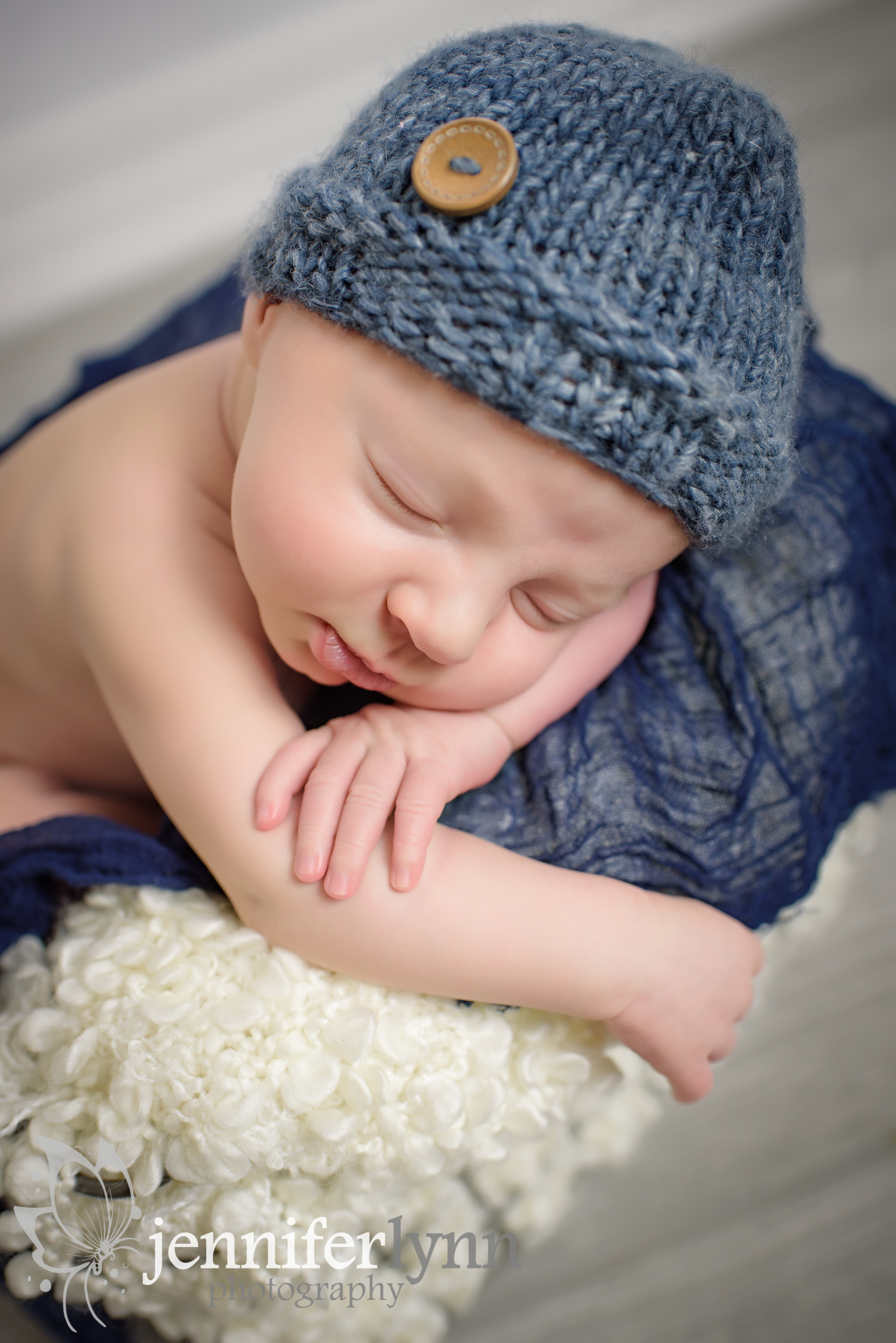 Newborn Boy Draped Over a Basket