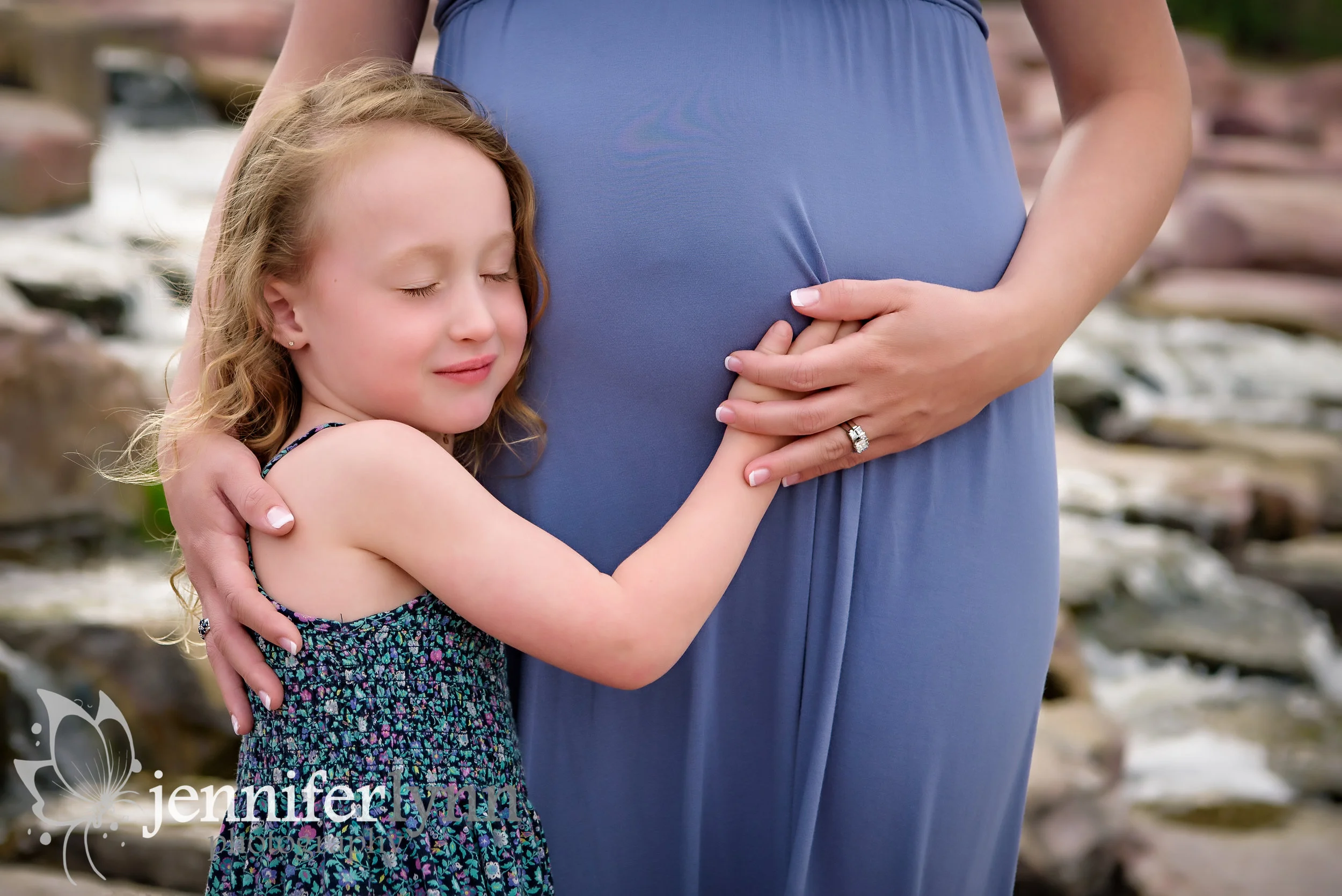 Daughter Listening to Mom's Belly