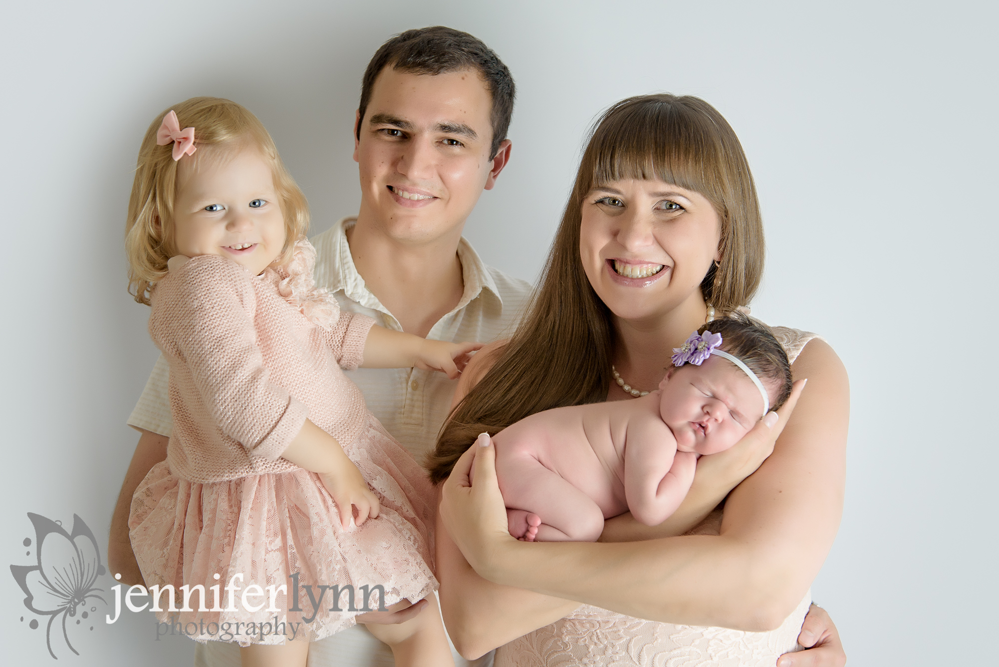 Family of four newborn girl purple