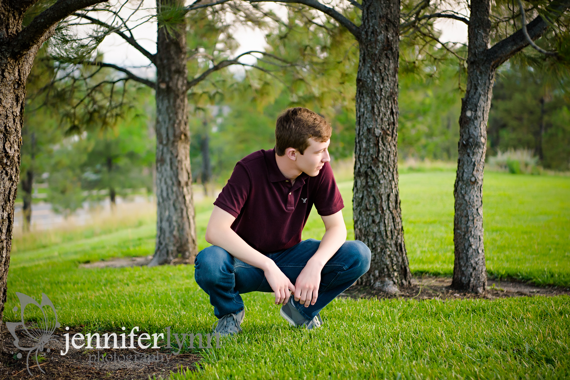Senior Boy Squatting and Gazing Off