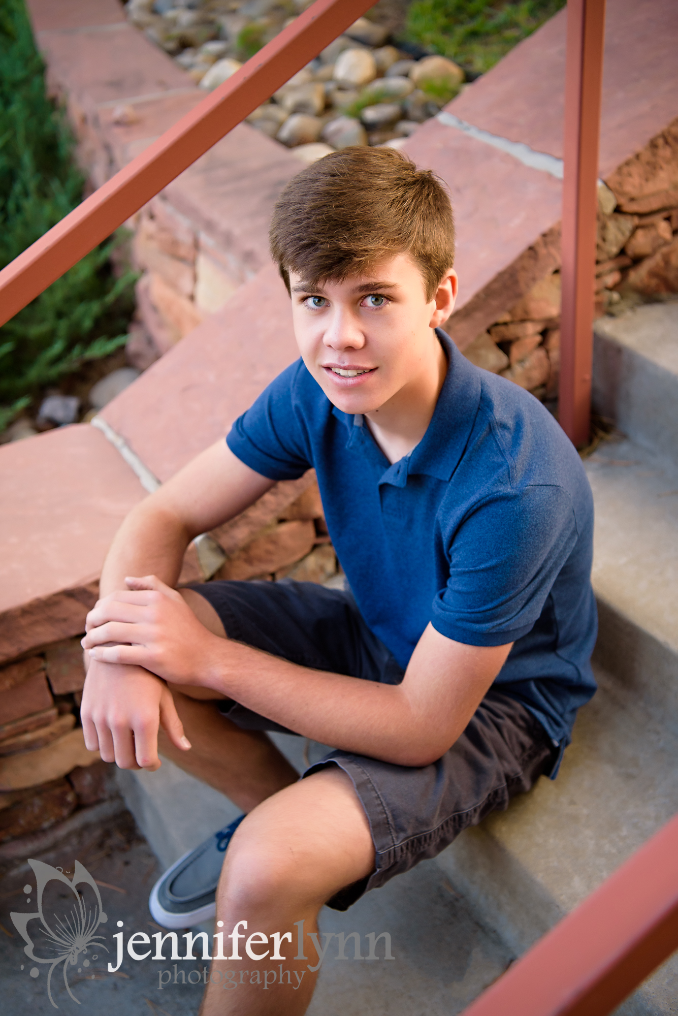 Senior Boy Sitting Outdoors Steps