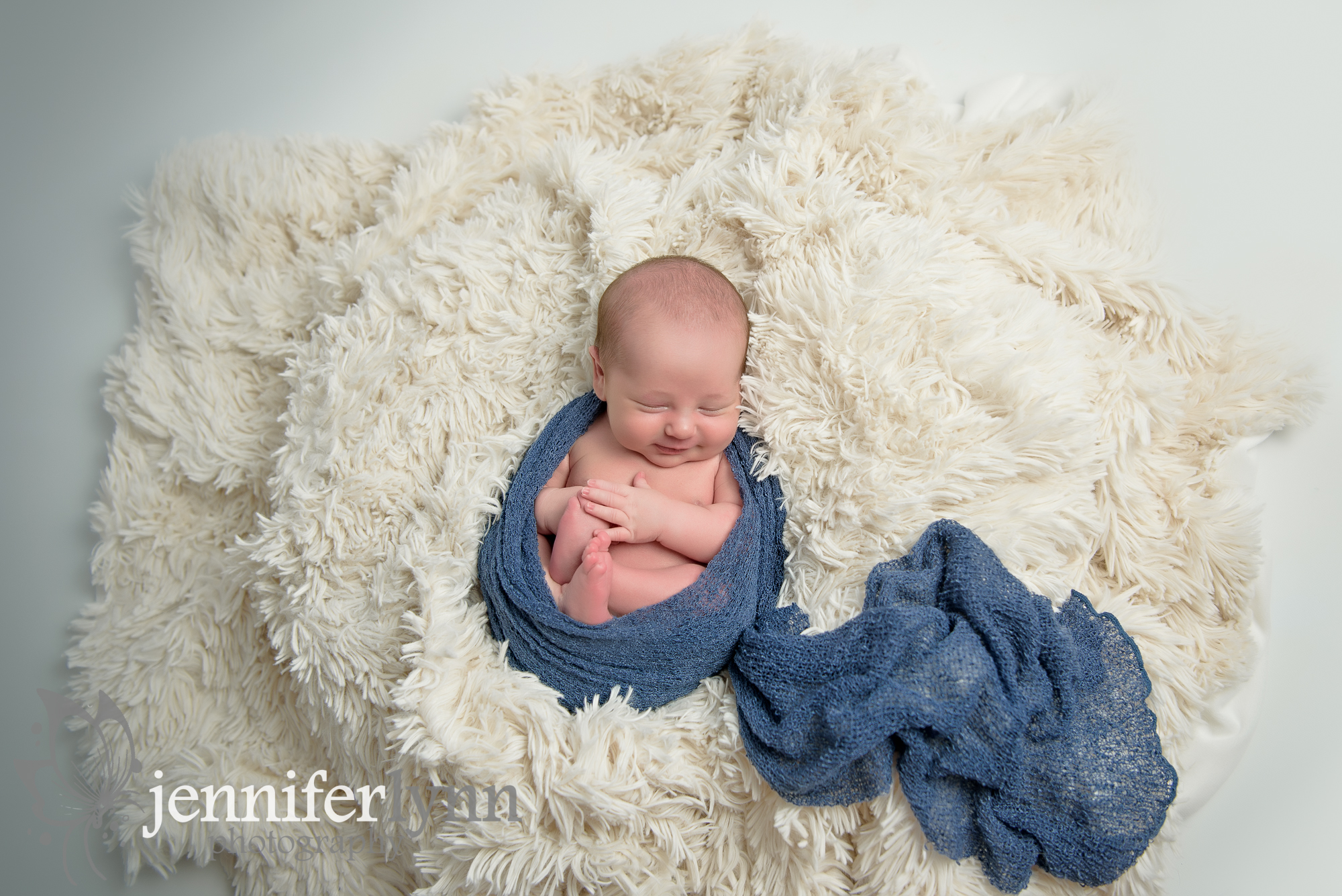 Newborn Boy Smile White Fur Blue Wrap