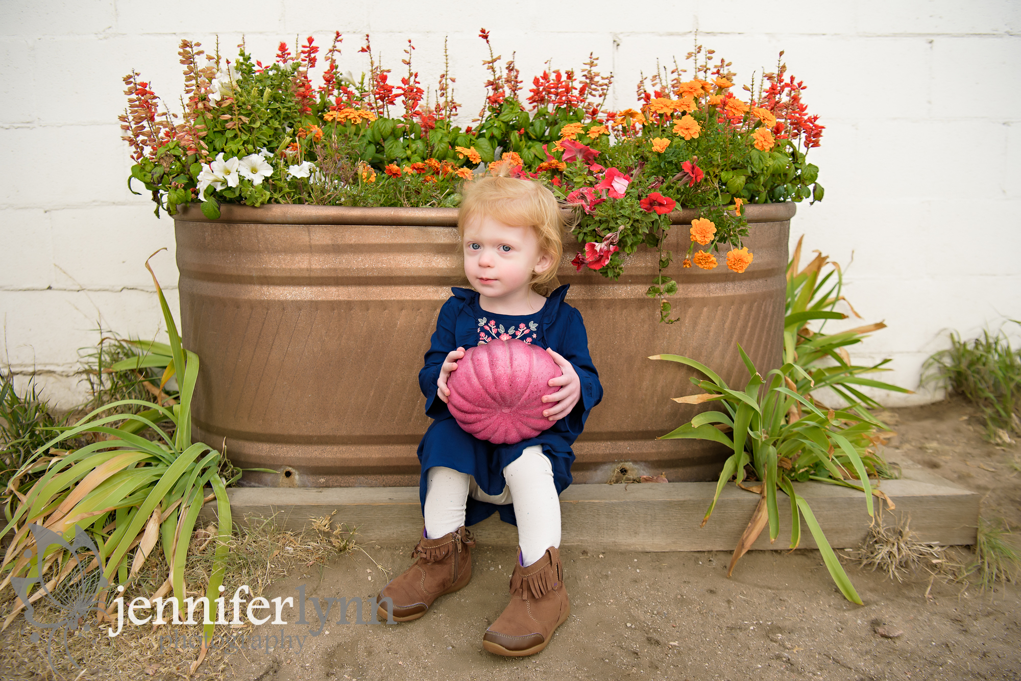 Girl Sitting Fall Flower Display Pumpkin