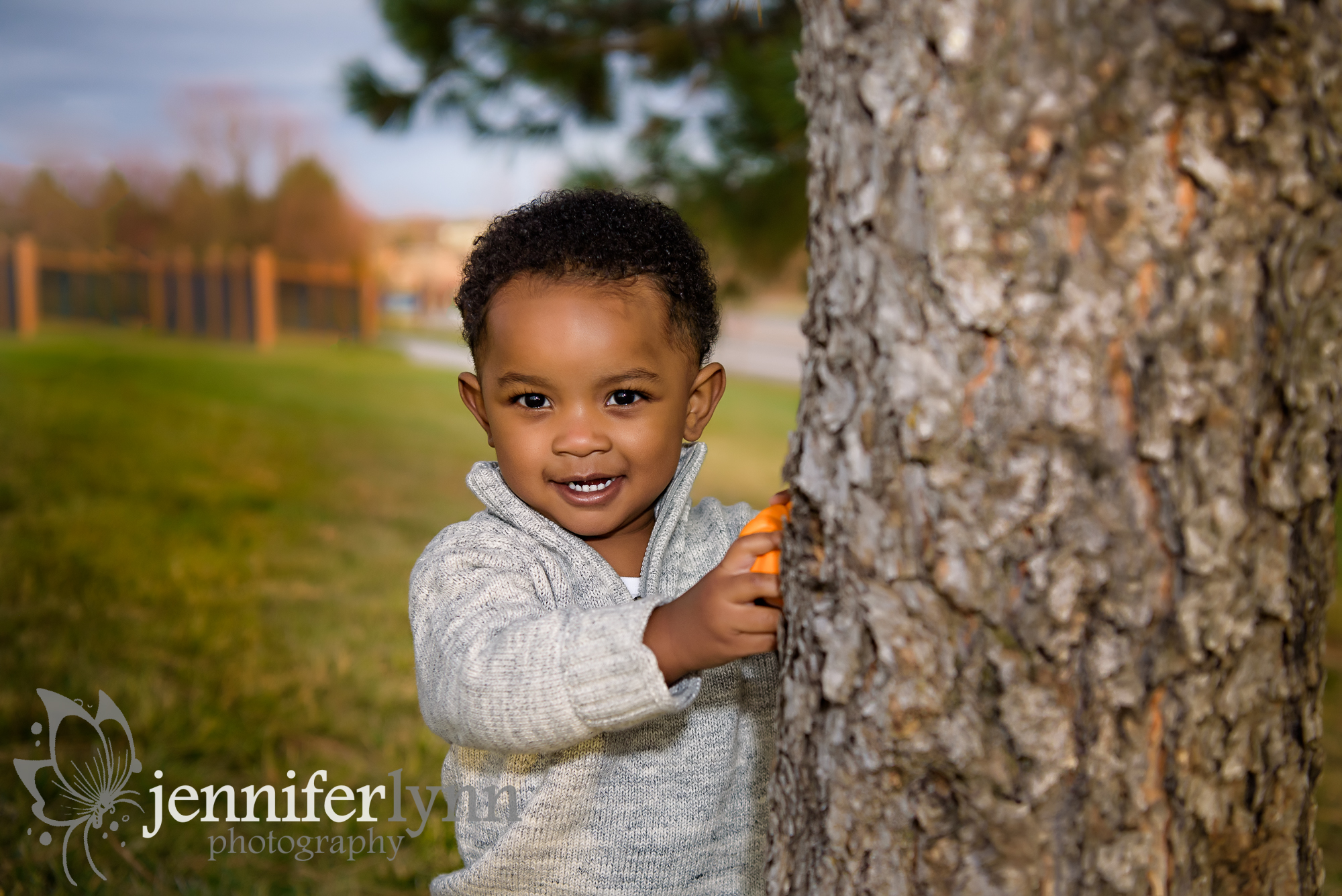 Toddler Peeking from Tree