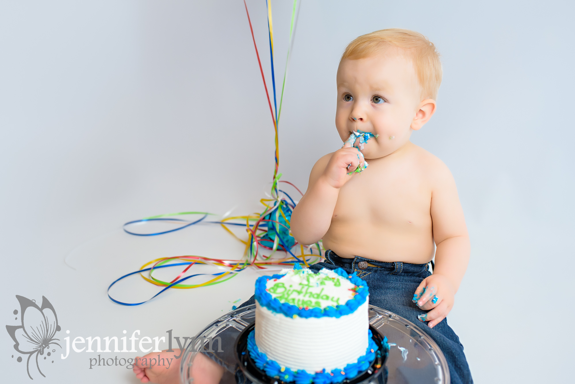 Baby Boy Eating Icing Birthday Session