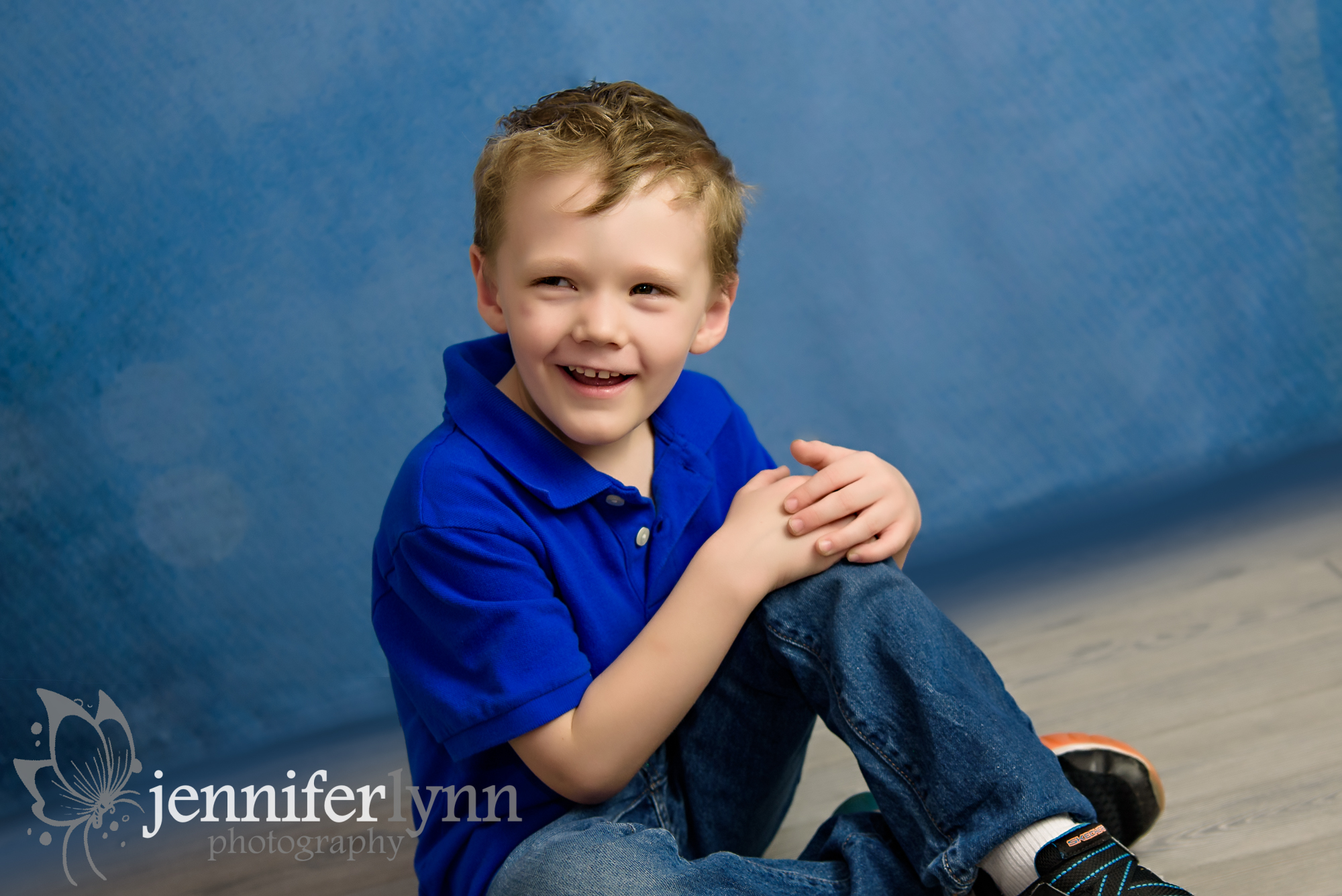 Boy Sitting Grey Wood Blue Shirt