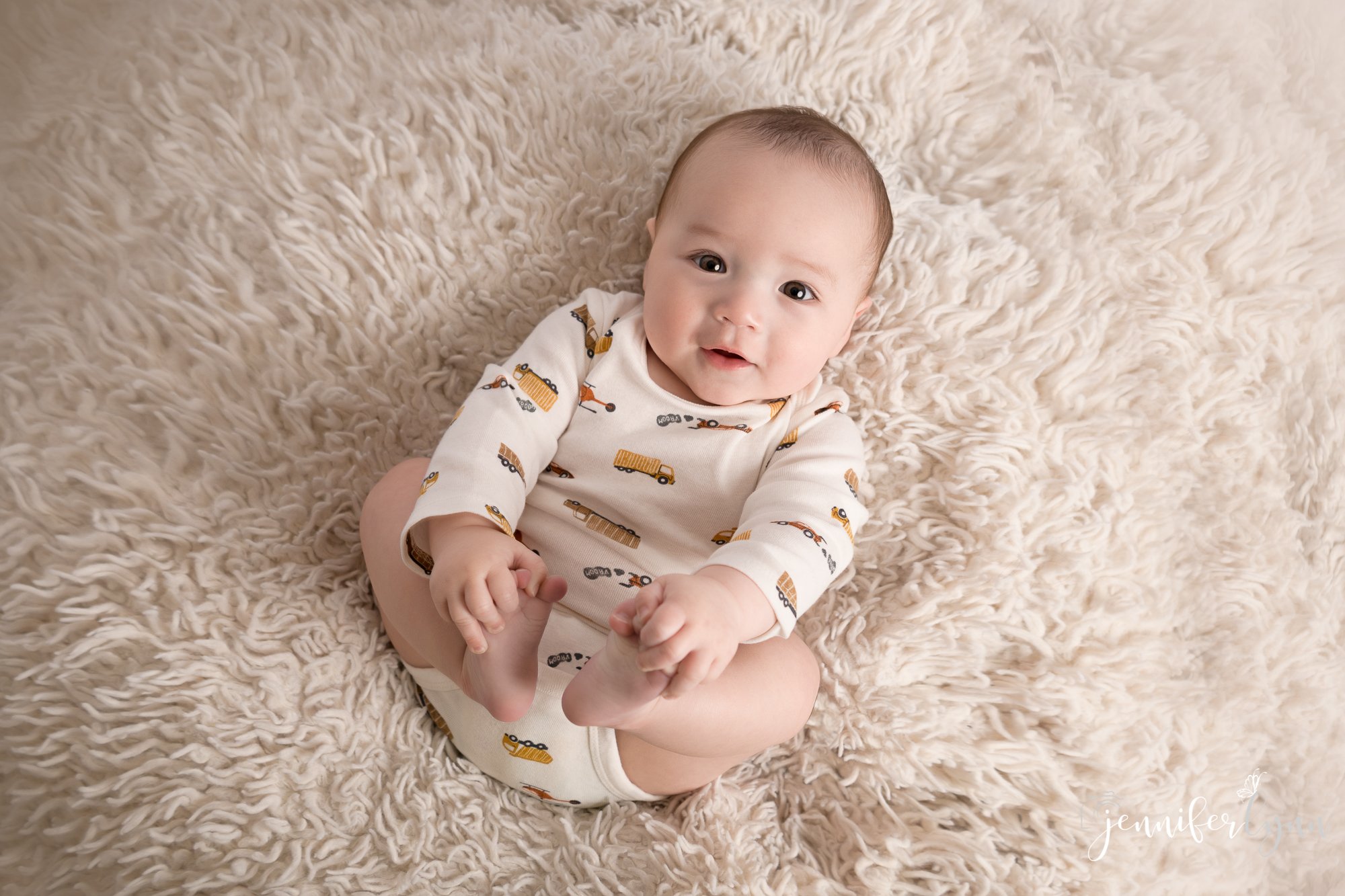 Newborn Boy Soft White Fur Holding Toes