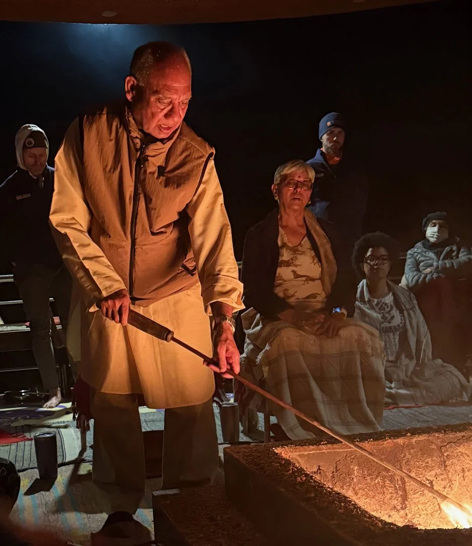 Sacred fire ceremony (Havan) during collective mantra practice in India, symbolizing devotion, ritual, and shared spiritual intention.