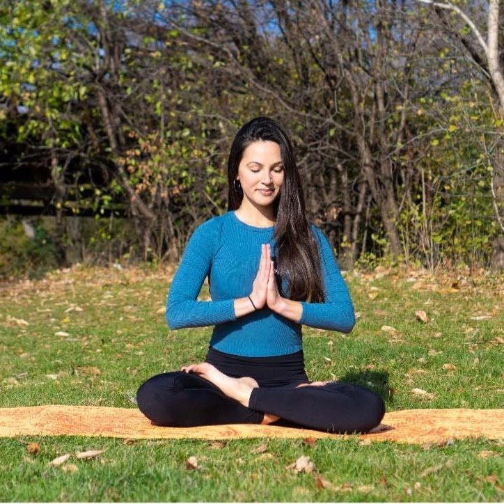 Katie Sayad - cow face yoga pose