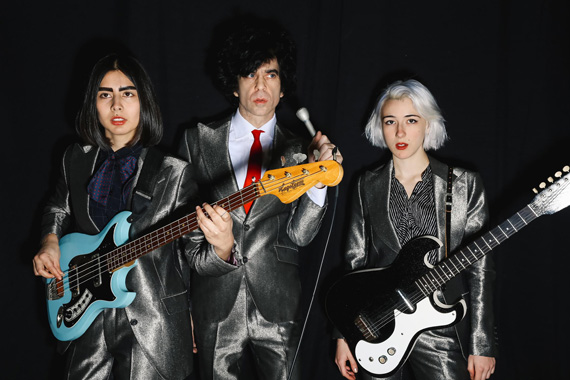 Custom Amber Doyle silver suits for Ian Svenonius of Chain and the Gang