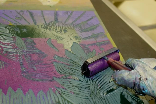 Ink up your printing plate to prepare for printing your last layer and your chine colle layer. I use small brayers sometimes because I like to "paint" my ink on to the surface of my plate. 
