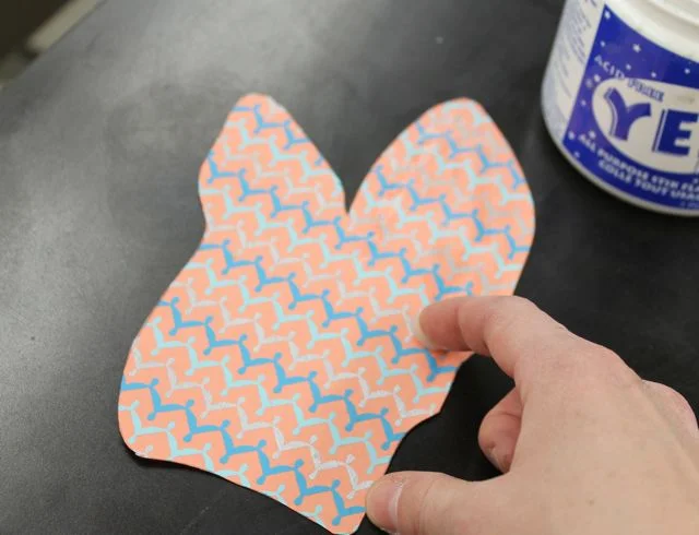 Add glue to the back of your chine colle paper (remember, the back of mine had a pattern). I use yes glue, rolex glue, spray mount, and traditional wheat or rice glue for this step. Use an archival glue always! Don't use too much, or get the glue too close to the edges of the shape.