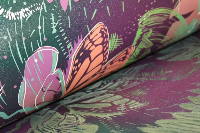 Lay the printed paper over your inked up block and the chine colle paper, and run this through the press. You can see part of my "reveal" in this photo with the chine colle paper now attached and printed within my print.