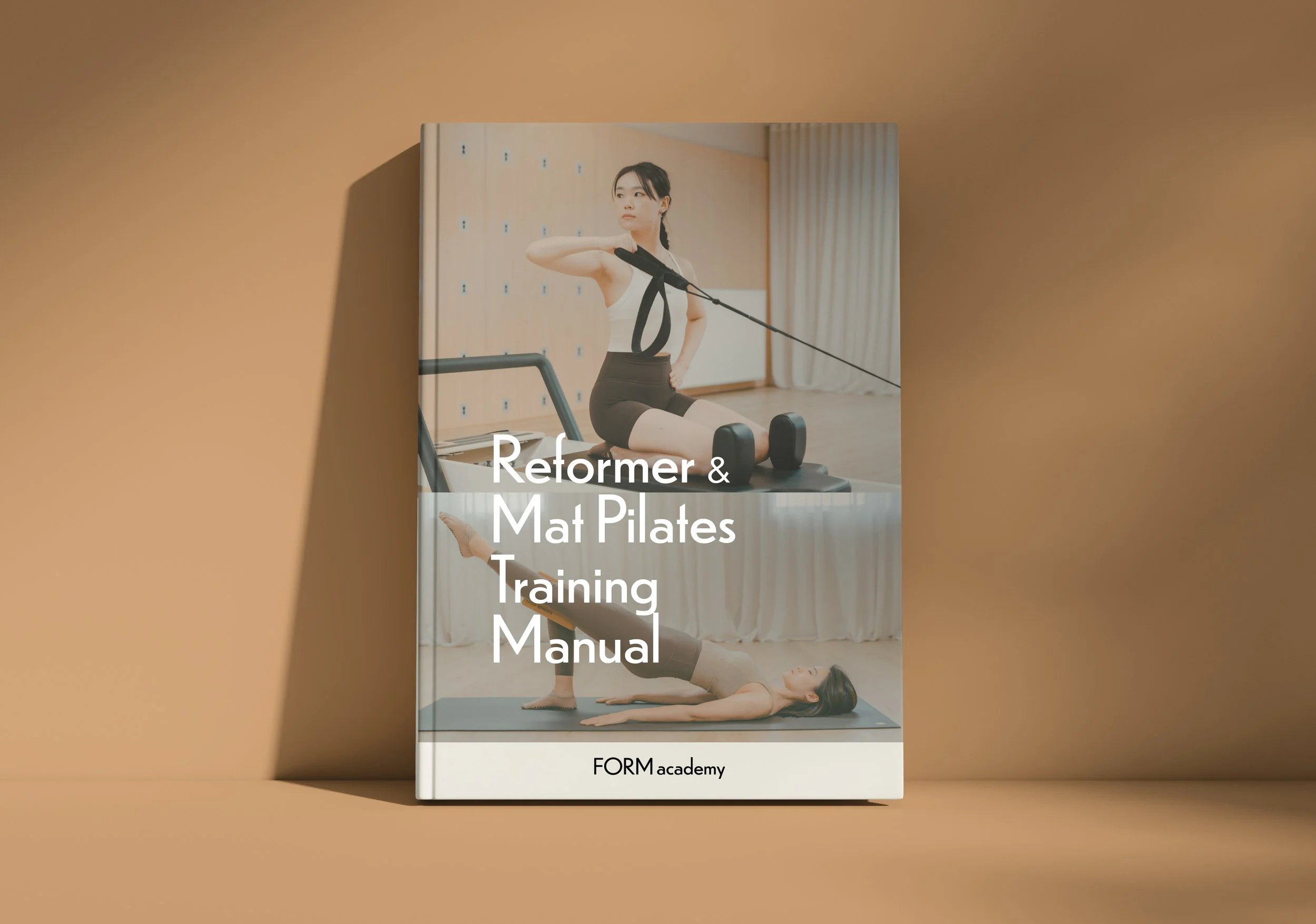 Book titled 'Reformer & Mat Pilates Training Manual' with cover featuring images of women exercising on Pilates equipment and a mat.