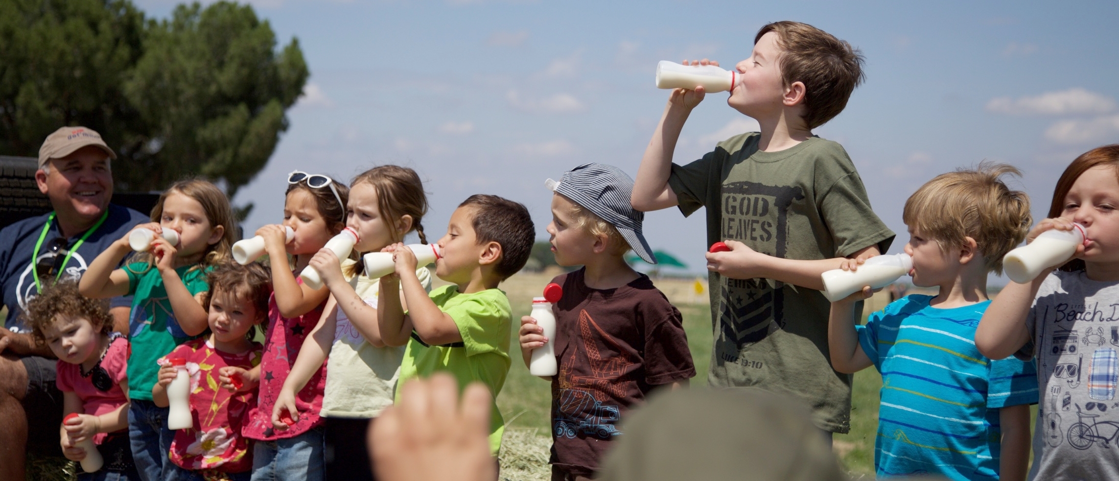 Photo: Kids enjoying their raw milk from Organic Pastures dairy with Mark McAfee, chairman of the Raw Milk Institute . Raw milk has always been legal in California, USA.