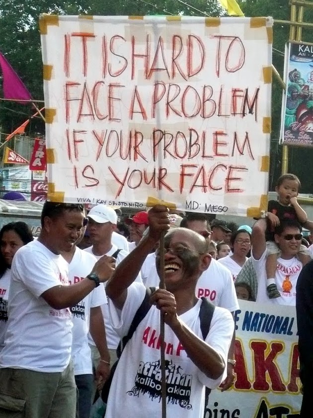   reveler at the ati-atihan parade, kalibo, philippines  