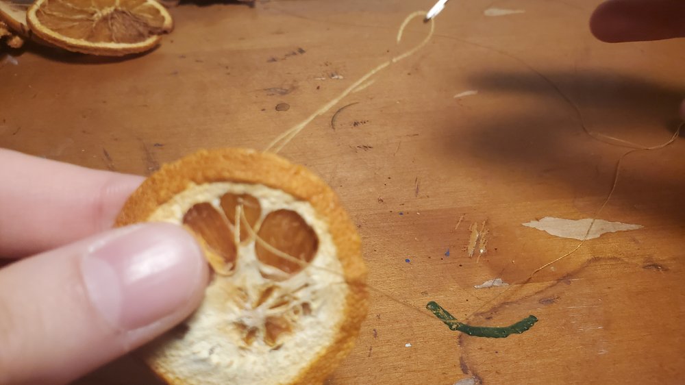  When you get to your last piece of fruit, tie the end of the thread onto it.&nbsp; 