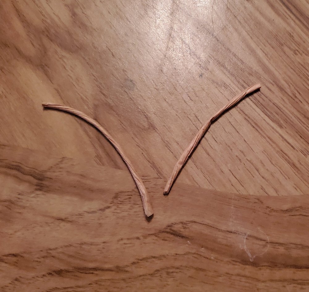  Cut two short pieces of string 