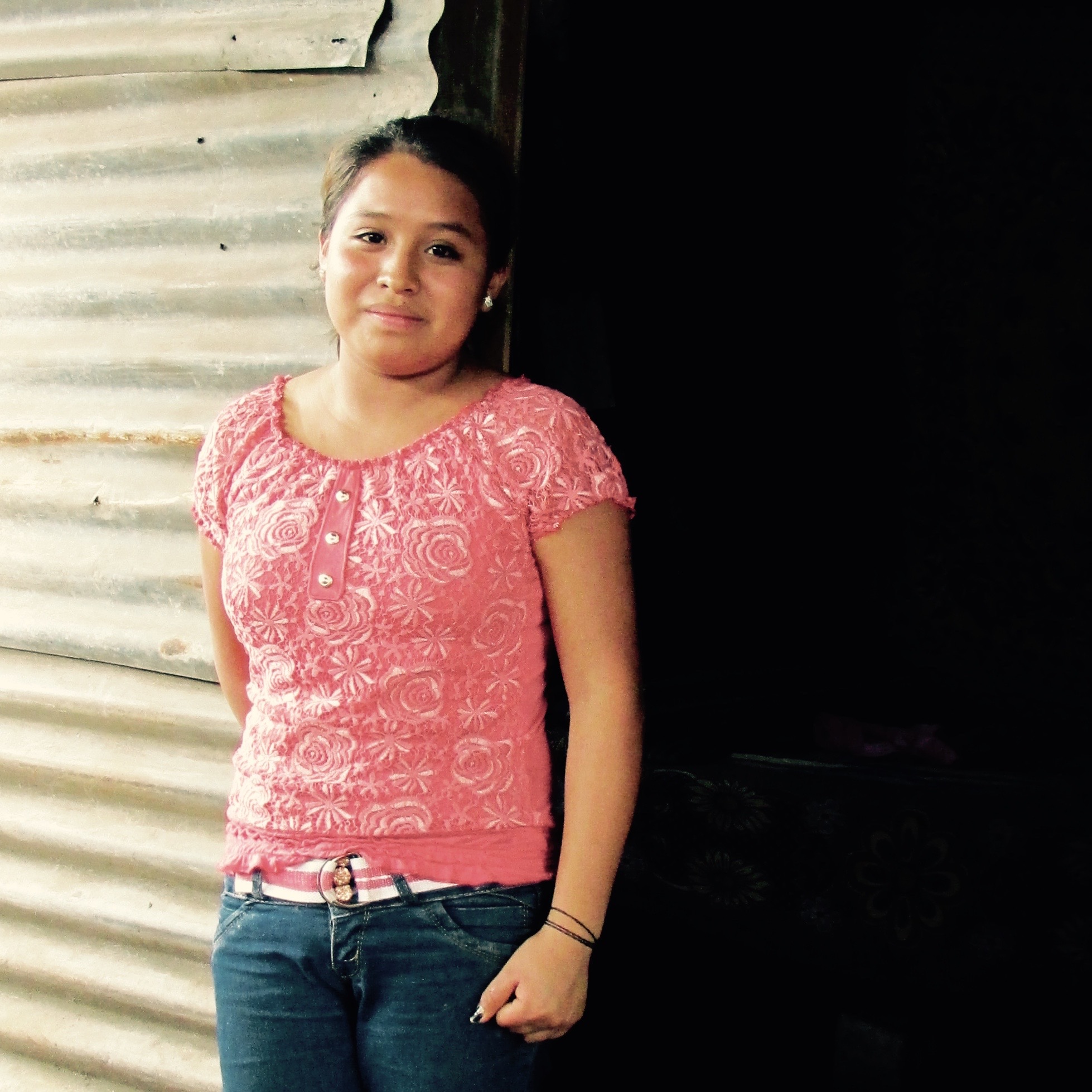 Francisca, one of the children, in front of the former shelter