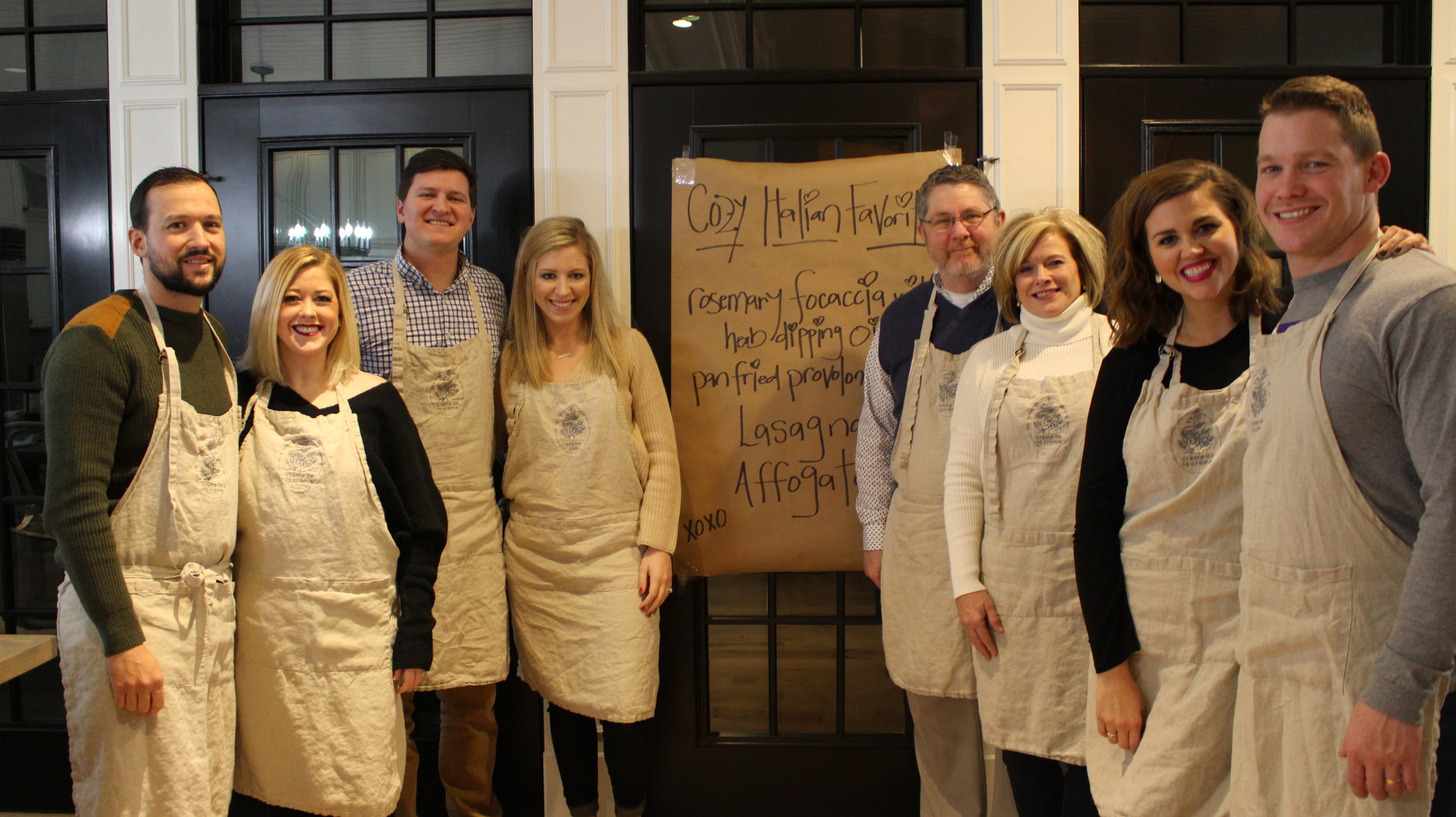  Beautiful family, aprons donned and ready to cook! 