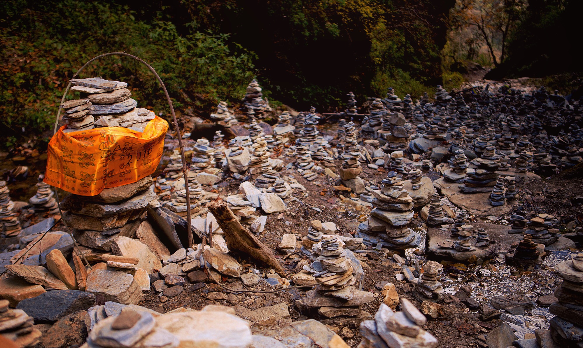 Nov 9.5, 2016 A corner revealed a quarried infinity of cairns (pronounced \ˈkern\). It must be one of the largest collections in the world, spanning as far as eyes could see. Each stack with an identity; some with writing, some flowers, some with small sticks patterned at the base. Why the human spirit is magnetized, why it manifests in these adornments is a wonderful mystery. Here, perhaps it’s our wanting to build, and construct, to achieve new heights, to observe the endurance of our delible doings.