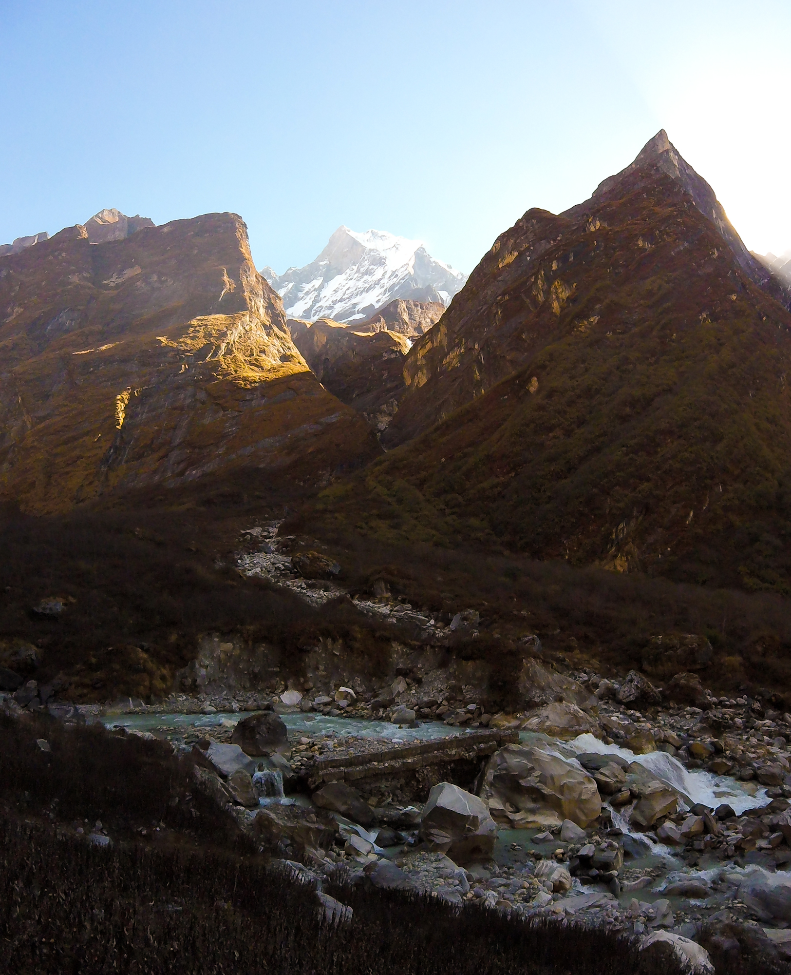 Nov 13.1, 2016Clothes lift off the line frozen solid. Cold toes last night. Today is a 1,210 metre descent to Bamboo. We catch light briefly at Base Camp but soon sink into a shadow, hugging the valley downwards.