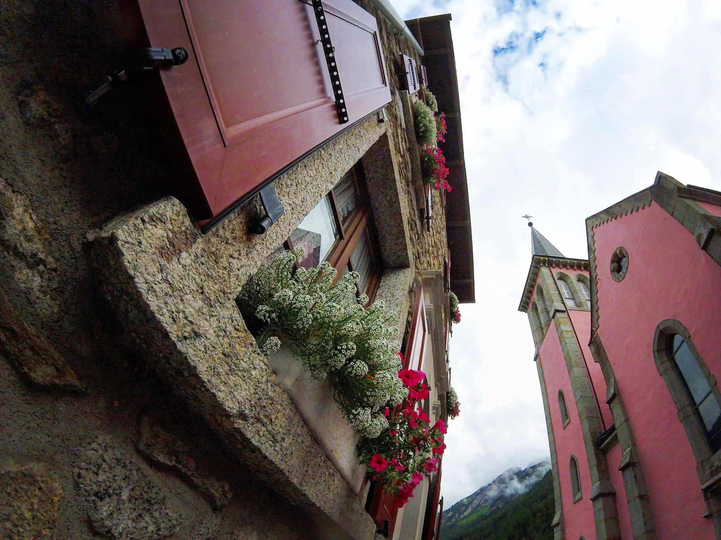 Day 2: Trient, Valais Swiss geography but French nevertheless, Trient is a most wonderful small village in a valley (Vallée du Trient). The skyline is capped by a perfectly pink chapel and rustic homes with flowers bursting open shutters of rouge.