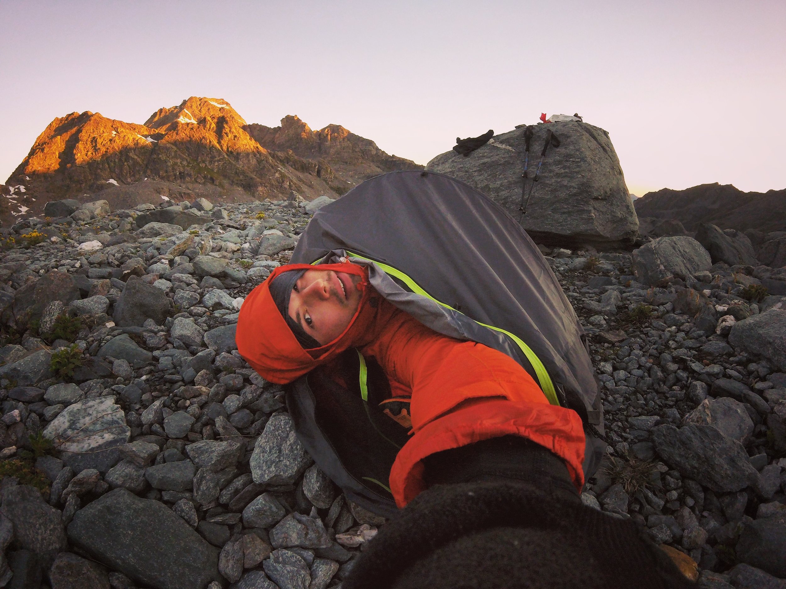 Day 5: Lac du Grand Désert 6:14 AM It was the gravel bed of a mountain desert lake. To my head was the Grand Désert Glacier and to my feet the lakes of its runoff. Never did I understand the worship of Apollo so well until the sun removed that ghastly, cold shadow of night. cc @outdoorresearch #helium