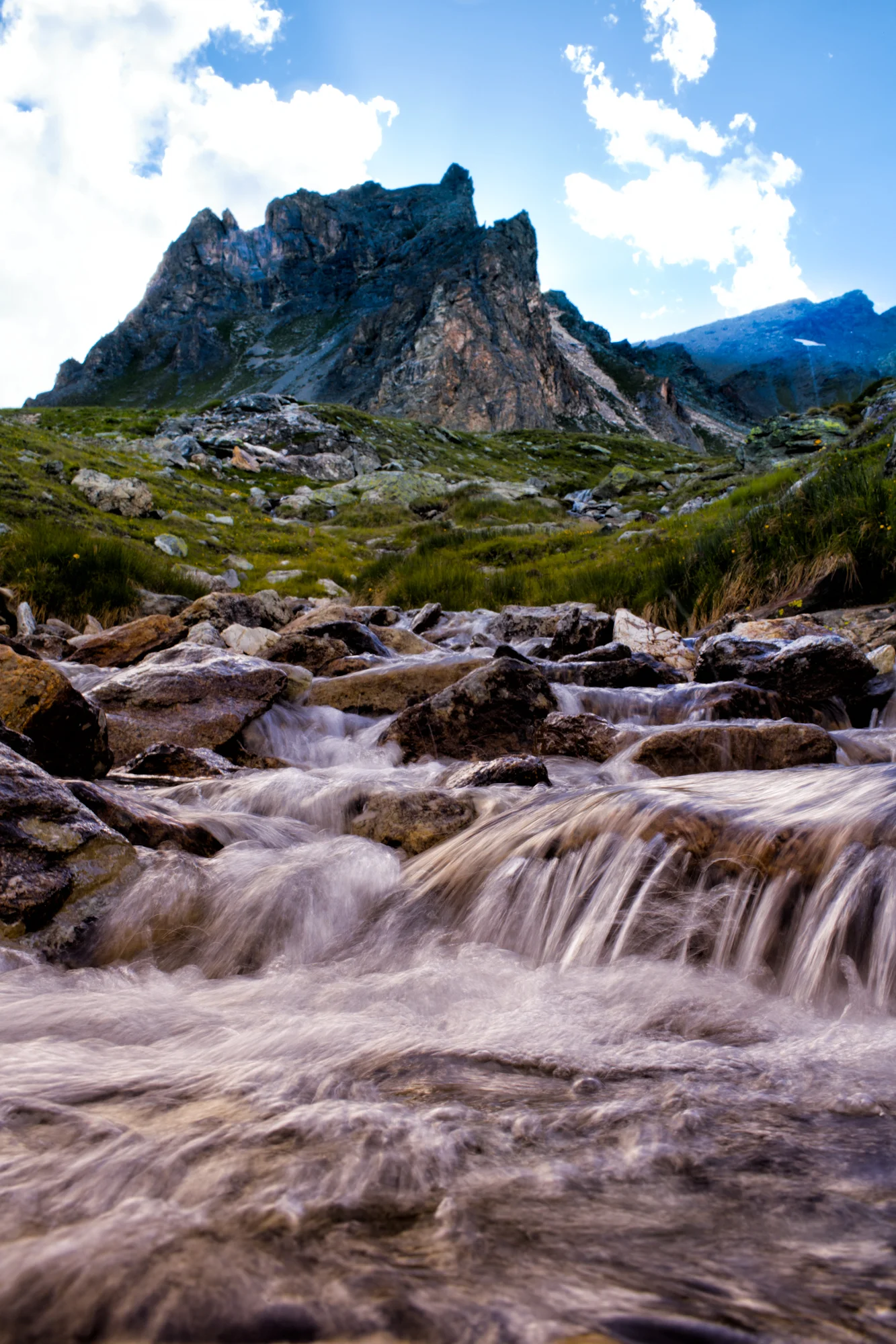 Day 5: Evolène, Switzerland The descent is a gentler grade. Greenery emerges again and the path becomes altogether less thrilling. Torrent d'Arolla flows from the north an hour west of a days end.
