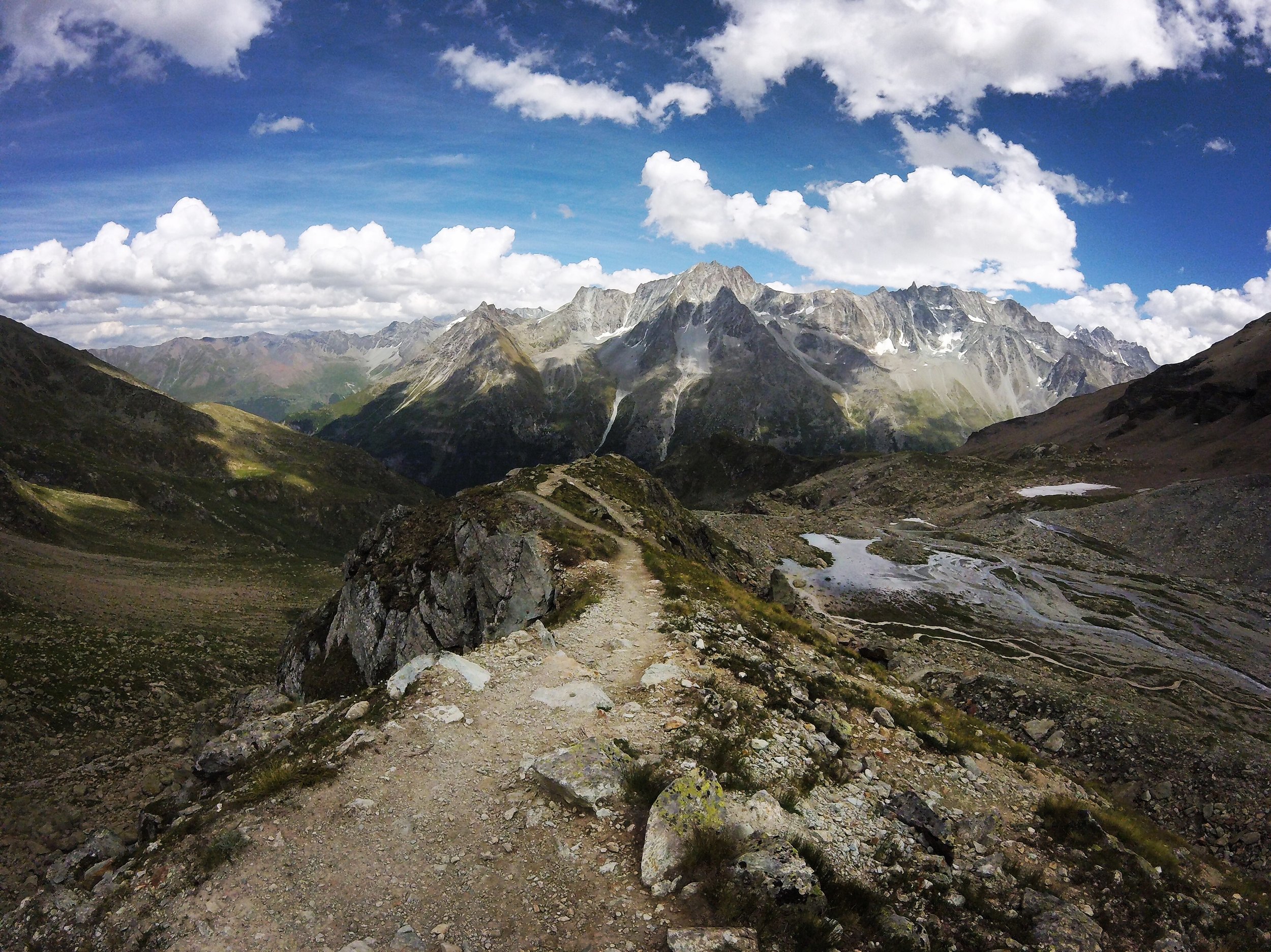 Day 7: Aiguilles Rouges Down from Cabane Aiguilles Rouges the path aims towards Dent de Perroc, Aiguille de la Tsa, La Maya...