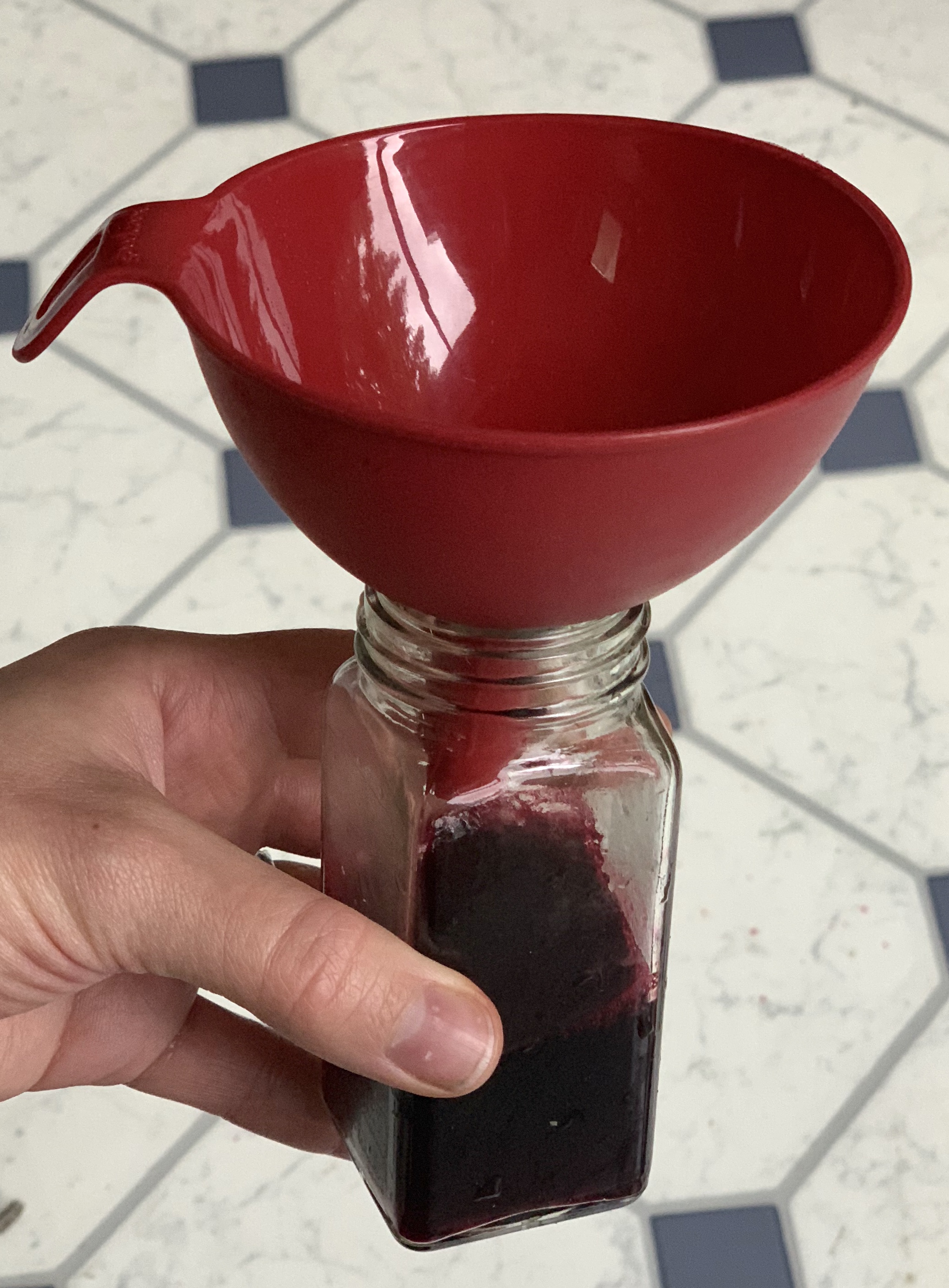 When beets are soft pour the liquid through a funnel (unless you are good pouring without it :) into a jar of your choice