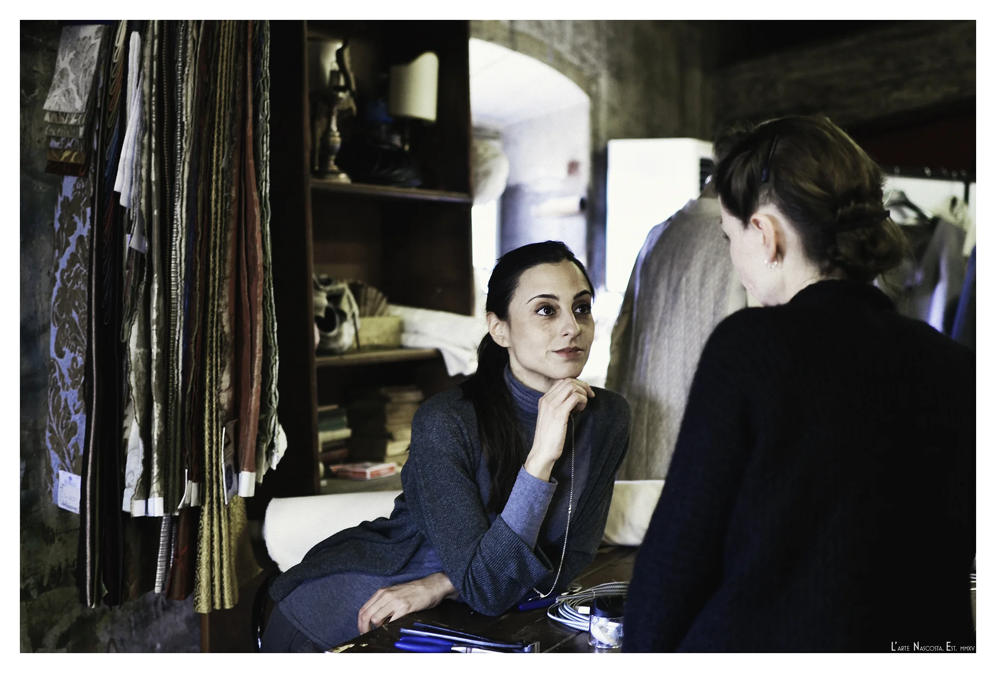 Elena Bianchini consulting with a co-creator in Teatro la Pergola's Set and Costume Design Studio.