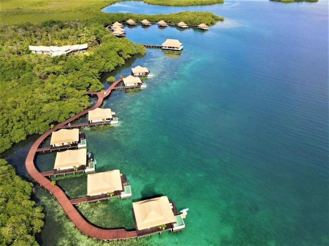 Trade the long haul for a short flight to this adults-only overwater retreat in Central America. Enjoy all-inclusive splendor for half the South Pacific rate in unmatched serenity. Begin your adventure with us. #AffordableLuxury #OverwaterBungalow #L