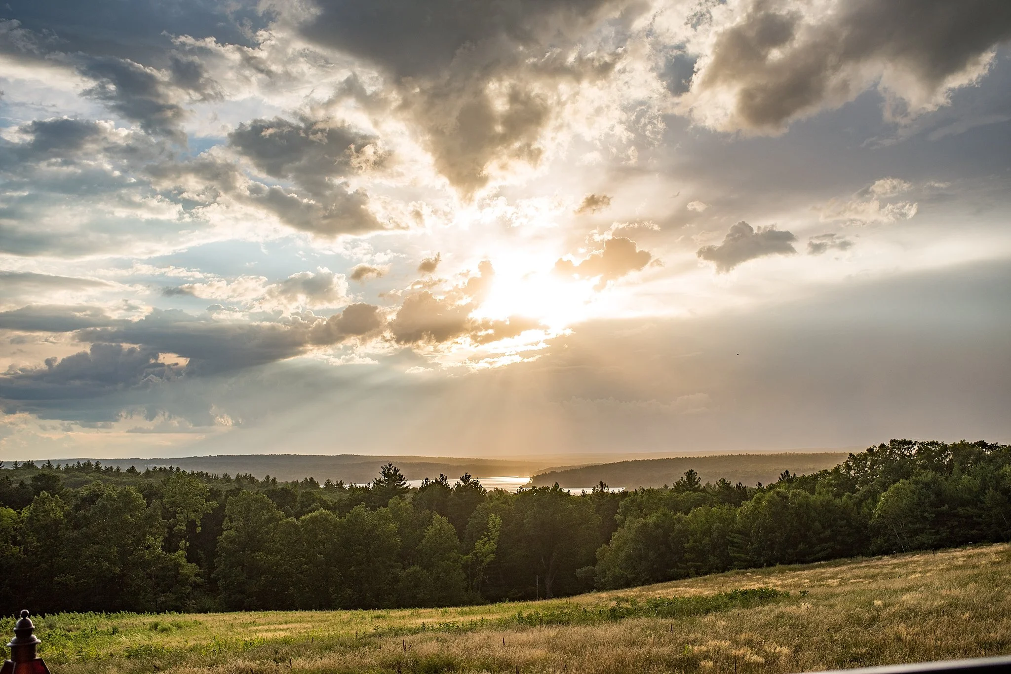the sun setting during an outdoor wedding