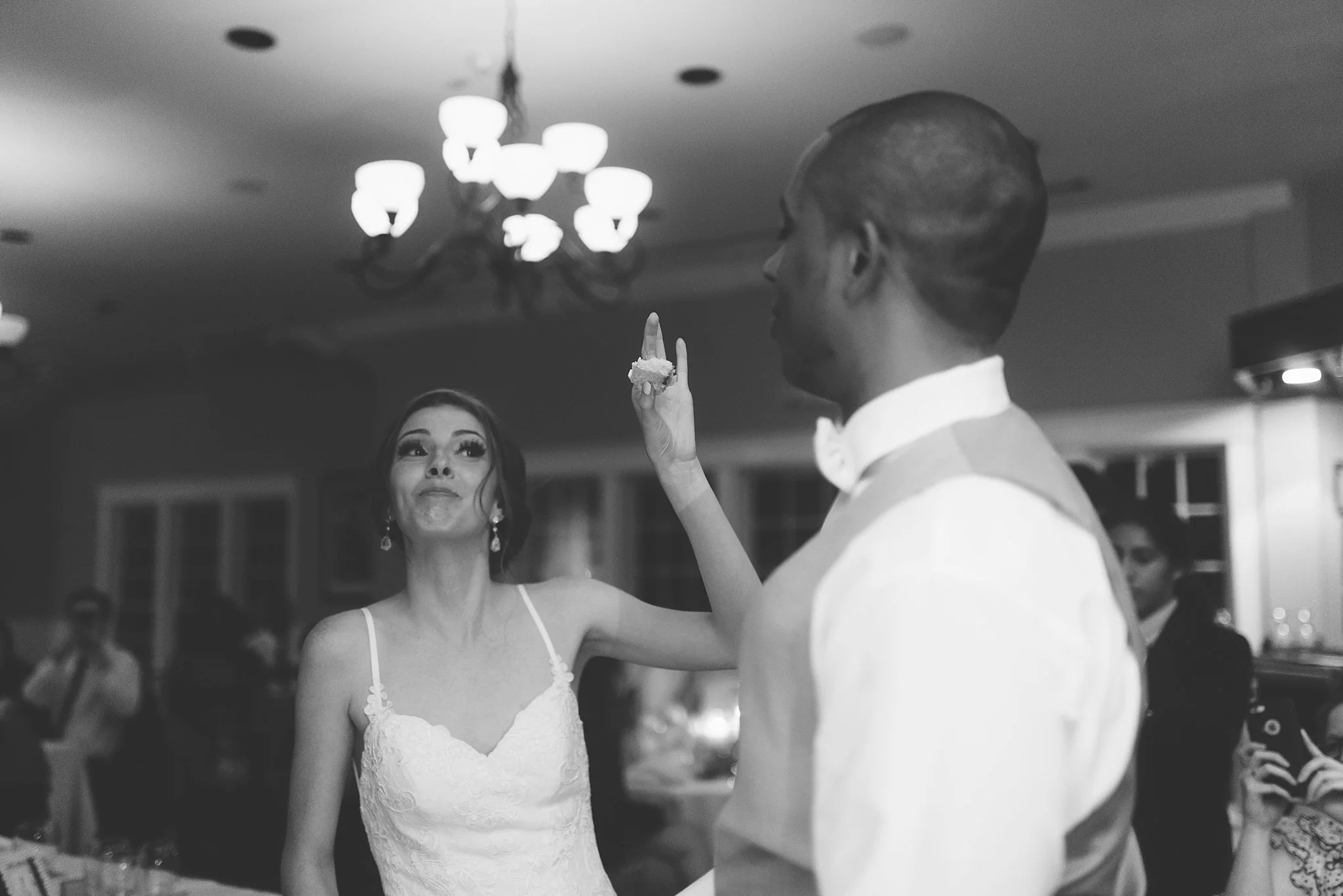 bride and groom feed each other cake .jpg