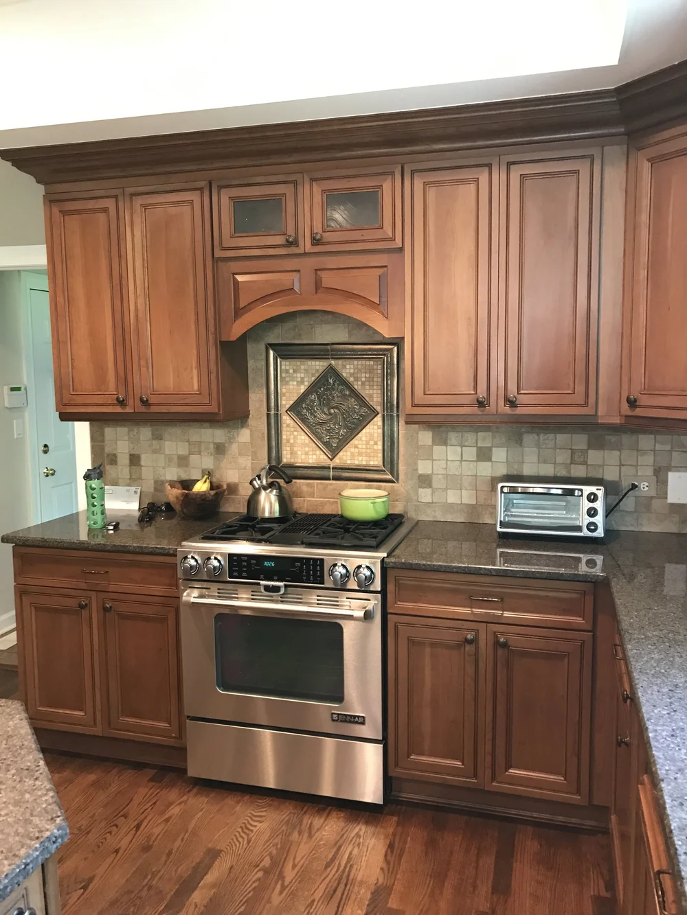 Kitchen With Wood Cabinets And Stainless Steel Appliances: Elegant Harmony
